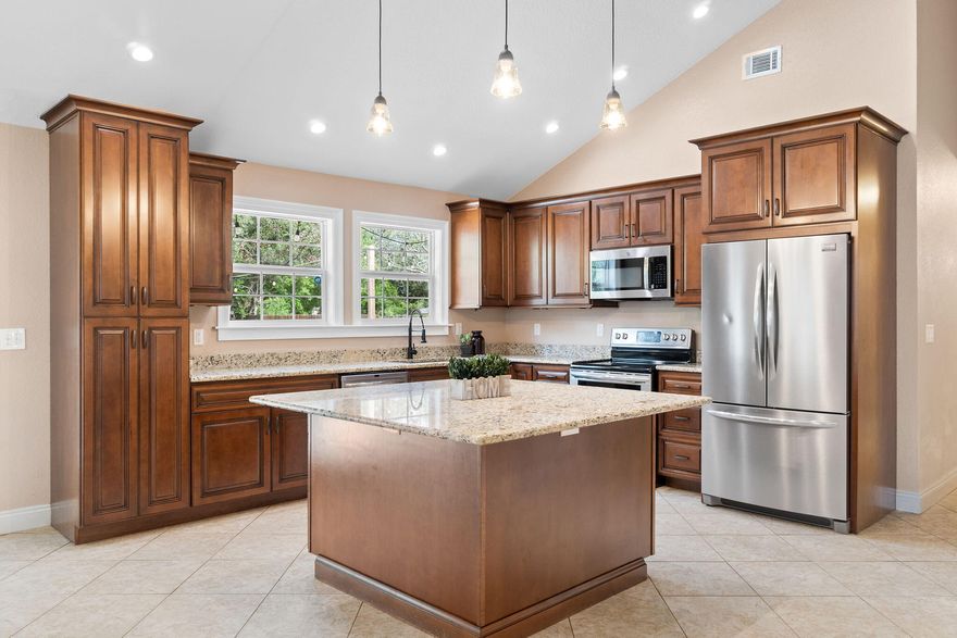 IRIS is a charming home is located in the highly sought-after Holley by the Sea community, where low HOA fees open the door to world-class amenities. Residents enjoy access to three swimming pools, tennis courts, a boat launch, a fitness center, sauna, steam room, basketball courts, an RV storage area--and so much more. Pickle ball was also recently added.Perfectly positioned on the west end of Navarre, you'll love the tranquil entrance to Sunrise, complete with ponds and ducks greeting you on the way home. Tucked away on a quiet street, this property sits on a half-acre, fully fenced lot, offering privacy and space to spread out. Step inside and you'll immediately notice how tall ceilings, abundant natural light, and an open layout make the home feel far more spacious than its square footage suggests. A complete remodel has brought new life herefeaturing brand-new kitchen cabinets, sleek countertops, and beautiful tile flooring laid at a 45?? angle. Newer windows invite sunlight into every corner.

The primary bedroom is generously sized with a double closet and a statement double barn door leading to the en-suite bathroom. Here, you'll find a tall, deep walk-in shower (no tub), a linen closet, and a double vanity for added convenience.

The two additional bedrooms boast new carpet and padding, fresh paint, and great natural lighting. The massive kitchen island and upgraded cabinetry provide plenty of prep and storage spaceideal for cooking or entertaining. A cathedral ceiling in the living room enhances the open feel.

All appliances convey, including the washer and dryer (as-is). The deep laundry room connects directly to the primary bedroom for easy laundry days and features extra shelving for storage. There's also a deep one-car garage with additional washer/dryer hookups (as-is).

For peace of mind, the home comes with plywood storm coverings for all windows and will receive a brand-new architectural roof prior to closing. The HVAC has been recently serviced, the water heater appears newer (exact age unknown), and the irrigation pump is brand new (not currently connected to the Rain Bird system).

Outside, the home's brick and hardy board siding (no vinyl) adds durability and curb appeal. A recent landscape refresh completes the package. Inside and out, there's a subtle mini-craftsman charm that the next homeowner will appreciatealong with the location, quality, and value.

Priced competitively for a quicker closingdon't miss this opportunity!