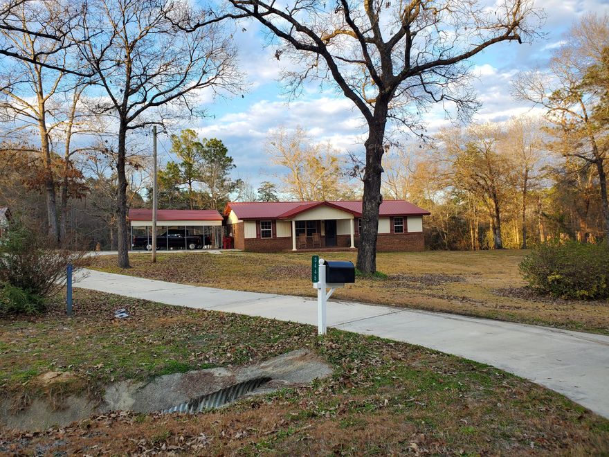 You have finally found it!  Peaceful country living north of Crestview.  Three bedroom 2 bath brick home with 2.24 acres on paved highway.  The home is well maintained and features many renovations.  It is recently painted, has Low E windows and a metal roof. There is a garden area, wild blueberry bushes, grape vines, pear tree and banana trees.  A back corner of the property is on a beaver pond.  Additional outdoor buildings include a bonus room (lots of potential) and single garage, a double carport and enclosed boat shed.  There are security cameras and a Ring doorbell.  Irrigation for the garden and lawn is provided by a 180+ foot deep well.  Don't miss this opportunity. Seller is licensed real estate agent.