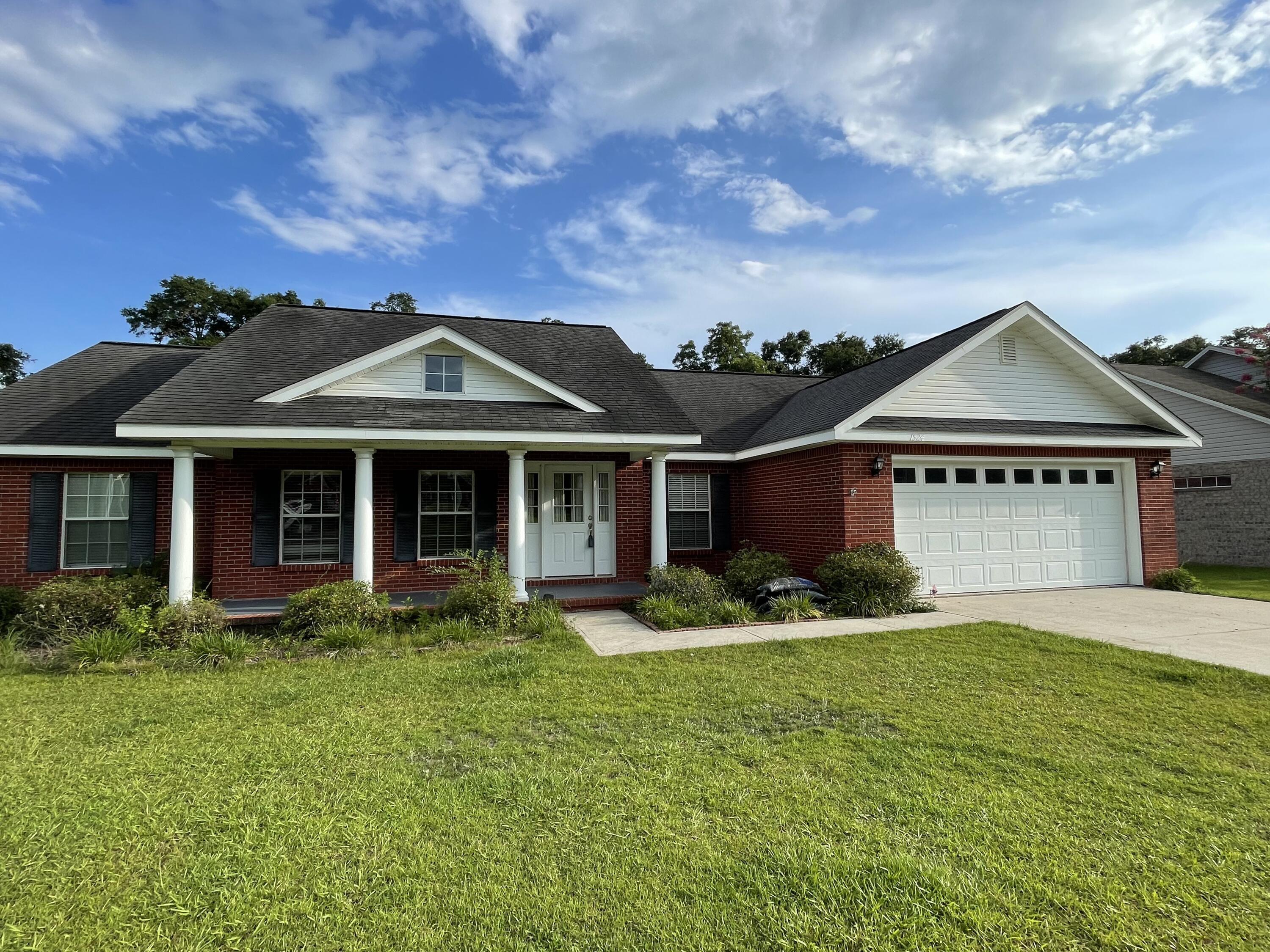 Fall in love with your forever home! This family ready all brick home is located in short distance from Baker school. Step into this home and notice the high ceilings, the delicate french doors to the dining area that leads to a covered porch. Perfect for family gatherings! Head into the Kitchen which includes stainless steel appliances, pantry, and a large breakfast bar. Down the Hall notice the handicap accessible bathroom, the Spacious bedroom and the Majestic master bedroom fit for a King and Queen. Large walk in closet, cultured marble double vanity, separate shower, and a Garden tub.Great for a spa day at home! Spacious enough to meet everyone's needs, like a double garage. Don't miss out on this opportunity of a lifetime!!