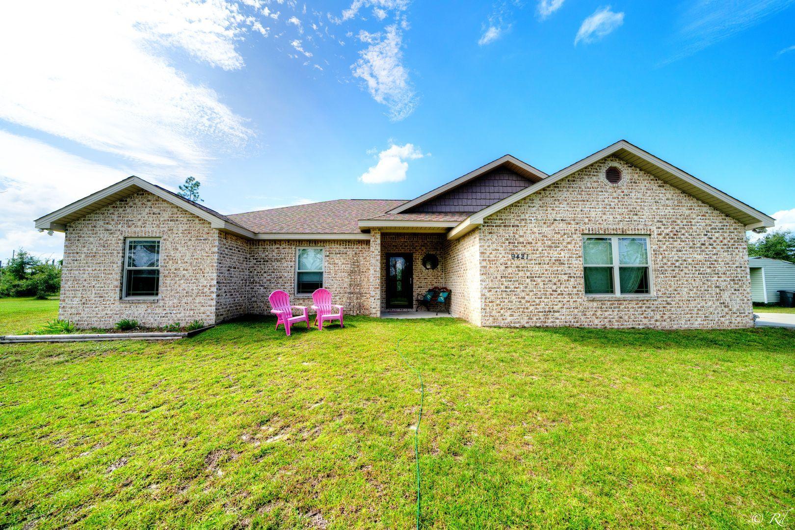 Gorgeous turn key ready home in a quiet community Convenient to shopping, food, and more without the noise! Laminate flooring and tile in the wet areas. R44 for insulation in the living room and R 30 in the garage. Raised ceilings with crown molding. Split floor plan. Master bath has tile surround oversized tub. Guest wing features three full beds and a bath. Huge hall closet in the laundry area. Outside there are citrus trees, blueberry bushes, garden plots and a fire pit. The Hamocks stay! New roof and siding in 2019. Huge hall closet and laundry area. Heating, air and hot water heater new in 2015 . Home is wired for a whole house generator. Workbench in the garage stays. Termite bond with Terminex. This won't last long!