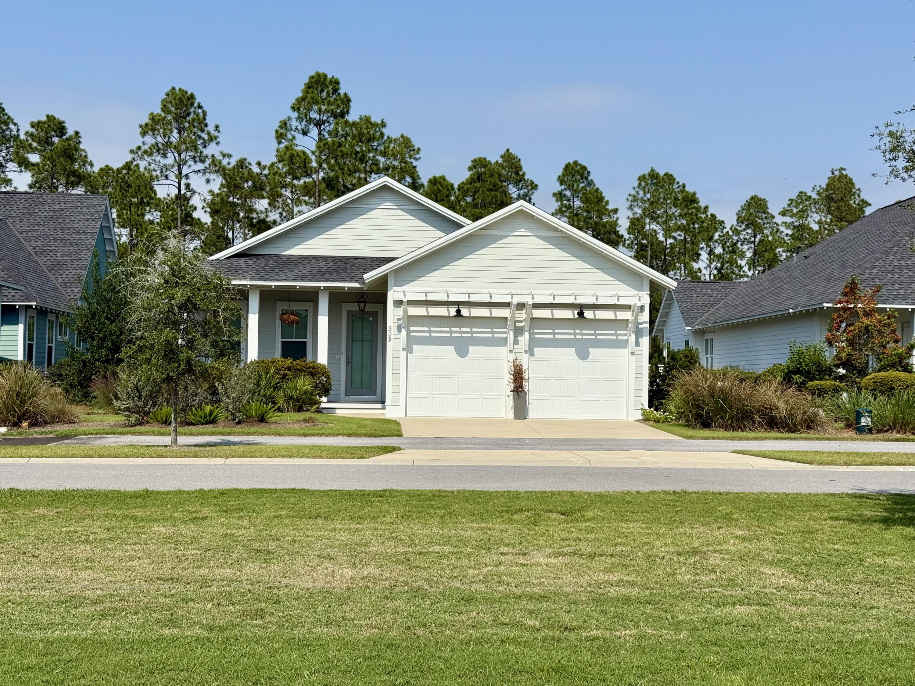 RECENTLY REDUCED BY $600 PER MONTH!! Newer-built, Watersound Origins home on one-level with 4 bedrooms and 3 bathrooms and a 2 car garage with epoxy flooring. This home is located on a premium lot with lots of privacy - facing a community park in the front and backing up to a serene pond surrounded by woods. Wood flooring throughout, solid core doors, high-end Bosch appliances, 10 foot ceilings, screened-in back porch, large master bedroom, 2-inch blinds already installed, crown molding, upgraded tile in bathrooms, dry bar in kitchen and laundry room with plenty of storage. Attic space above garage can also be used for additional storage.Living in Watersound Origins means enjoying a neighborhood that values nature, recreation and community. With no short-term rentals permitted, this home is ideal for a full-time resident or someone looking for a luxurious second home. From scenic walking trails to golf, tennis and pickleball courts, basketball and a community pool, this enviable location provides the perfect blend of convenience and tranquility.