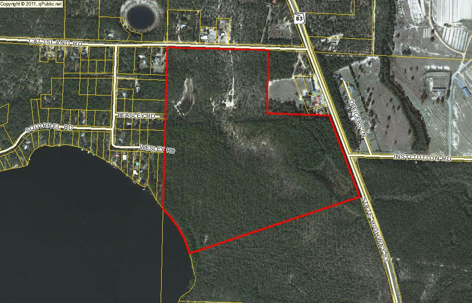 The Biggest & the Best! This parcel is the largest property left to purchase on Lake Juniper, a 620 acre state managed big bass lake. Juniper was built in 1962 by the Corp of Engineers. The subject property has 650 feet of waterfront, 1300 feet of Cat Island Road frontage and 1100 feet of road frontage on Hwy 83! Close to town! 45 minutes to the beaches of South Walton and the possibility of catching a state record large mouth bass.