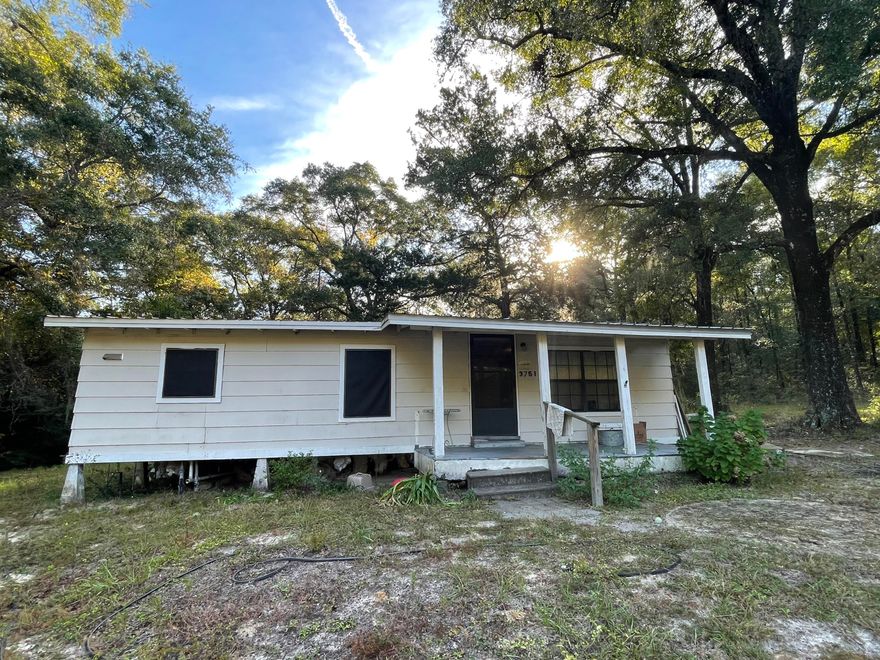 Looking for a project with potential? This quaint 3 bedroom, 1 bathroom home sitting on a generous 1 acre lot is your canvas for creativity. While it needs some TLC, this property offers a fantastic opportunity for those willing to roll up their sleeves and transform it into their dream home. It has a peaceful and private location away from the hustle and bustle of town. With some vision and effort, you can create a cozy haven on this spacious lot. This is a fantastic investor opportunity. Schedule your own private tour and start your renovation journey! The property has a deep well for water and a septic tank. The home has central heat and air however it doesn't currently work and is heated and cooled off a window unit. This home needs someone to put the love back into it to show the