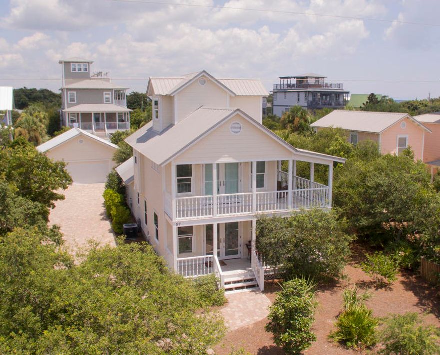 This magnificent Florida beach cottage is smack in the middle of one of the most desired communities of 30A. It is south of 30A; 1 block to 2 beach accesses in Blue Mountain Beach. This 3 bedroom, 3 bath home has a salt water pool, a 2 car garage and great outdoor space; including 2 huge wrap around porches, a covered deck by the pool and generous pool deck space. The driveway is oversized and can easily fit a boat and/or RV. Inside, a cozy open floor plan welcomes family and friend seeking a great beach experience. The home has been completely remodeled and painted and has been well maintained. The main living area has beautiful, low maintenance tile and the bedrooms feature hickory hard wood floors. The kitchen has all new, stainless steel appliances, a breakfast bar and plenty of