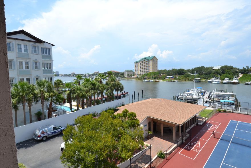 HARBOR FRONT RENTAL on Holiday Isle - 2 block Walk to the beach. This is a Harbor front 2BR/2BA unit available for long term lease, 6+ months or longer, at $2,000 per month plus utilities. This unit has wonderful views of the Harbor and is just steps from the beach. It offers tile floors in main area and WW carpet in bedrooms. The kitchen features granite counter top and breakfast bar. The living room and master suite are harbor front offering great views. The unit also boasts a balcony overlooking the harbor. Dolphin Point has a community pool and tennis courts plus a marina. NO PETS ARE ALLOWED AT THIS COMPLEX FOR RENTERS. Call today for your appointment to see this unit.