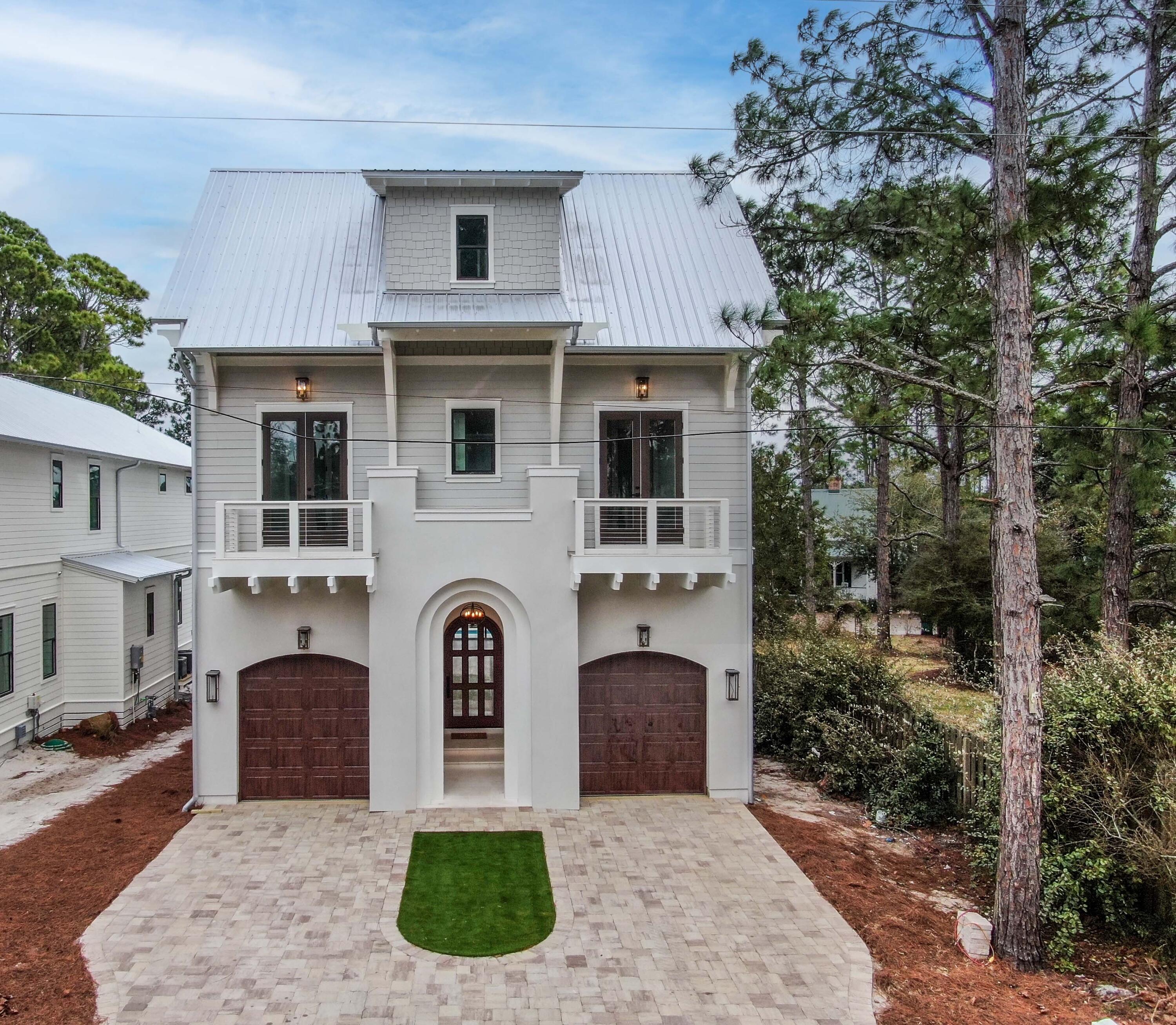 NEW CONSTRUCTION: Completed! Relax & enjoy your days by a heated saltwater pool that sits up overlooking a spectacular unobstructed view of Eastern Lake in Seagrove, south of 30A.  The solid rental history area along with the architectural beauty of this property makes this a fantastic opportunity for investors and full time residents. Gross rental projections are $392,849 a year. The 2 car garage home offers a chef's kitchen with a 48'' Wolf gas range, and a Subzero Fridge. You also have a full bathroom cubby bar and a fireplace that sits tall in this 12' ceiling first floor.  The large doors and windows offer beautiful views of the pool area, dock, lake and a summer kitchen off the back deck.  You may also relax on your dock or enjoy exploring Eastern Lake in a small motor boat.