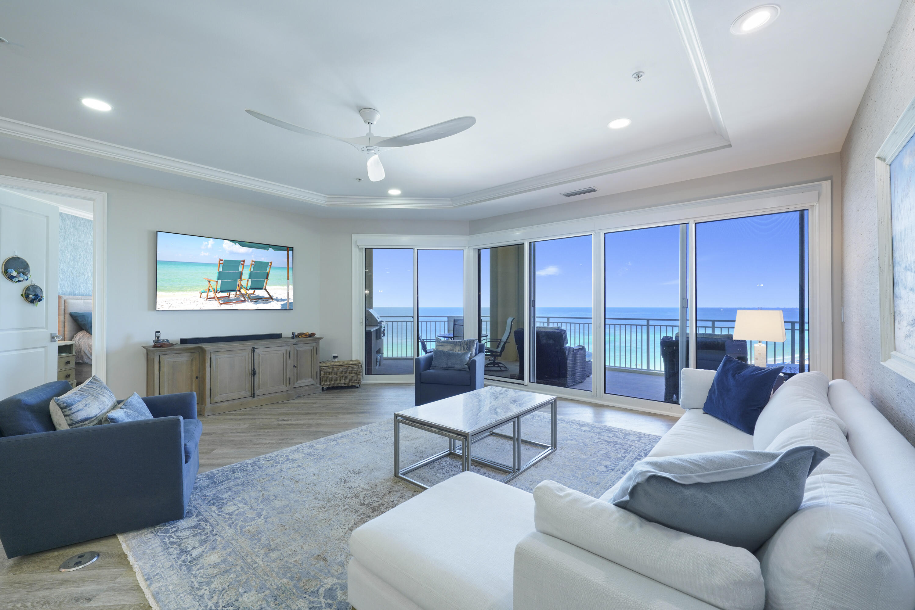 Presenting an exquisite 9th-floor Villa at Grand Dunes South Tower--a luxurious 3-bedroom, 3-bathroom residence boasting 2,500 sq. ft. of modern elegance and breathtaking Gulf views over South Walton's pristine, sugar-white sands. This expansive Villa offers the largest square footage among the 3-bedroom units. Access your private, elegantly-designed foyer from the semi-private elevator and admire the meticulous craftsmanship and high-end finishes. Fully furnished and turnkey, this Villa features premium amenities such as stylish shiplap in the foyer, upscale Luxury Vinyl Tile flooring, and stunning Quartz countertops and bar in the kitchen and secondary baths complete with all new sinks and plumbing fixtures. Highlights include an Elite "Wolf" 6 Burner Rangetop, Professional Stainless Steel Range Hood, a premium Cafe Professional electric wall oven with French doors, a built-in Cafe Advantium convection/microwave oven, a "Sub-Zero" refrigerator, a custom-fitted Scotsman ice maker, "Sub-Zero" wine cooler, and a "LG" dishwasher.
Additional features include custom cabinetry with chic new hardware and custom ceramic wall tiles for a unique encaustic appearance. Elegant blown glass table centerpieces and high-end art glass bowl pendant lighting from a prominent gallery add a touch of sophistication to this stunning villa, where exquisite and luxurious wall art enriches every room throughout. The living area boasts expansive floor-to-ceiling windows with sweeping Gulf views, soaring 9.5-foot ceilings, graceful recessed lighting, electric motorized shades, and solid wood doors.
The Primary Suite is a serene oasis featuring spacious "His & Hers" walk-in closets, tray and coffered ceilings, elegant custom Luxury Vinyl Tile flooring, exquisite furnishings, and stunning Gulf views. The luxurious Primary bath offers double vanities with custom Granite countertops, intricately crafted cabinetry, a sumptuous soaking tub beneath a chandelier, a dual-head shower, and a private water closet. The laundry room includes a utility sink, a stackable washer/dryer, and built-in cabinets for extra storage. This Villa is equipped with an HVAC system (replaced in 2017) and a water heater (replaced in 2019).
The Villa features an expansive 11' deep Gulf front balcony with 350 sq. ft. of space, a built-in natural gas grill, and stylish outdoor furnishings, all protected by durable "Hurricane Shutters."
Grand Dunes boasts exceptional amenities: ultra-quiet interiors, semi-private elevators, 24-hour security, gated entry, lush landscaping, two levels of gated underground parking, a private heated pool, an Owner's Lounge with Fitness Room, guest suites, 200' of deeded beach, a Gulf-front lagoon-style pool with a sparkling waterfall, and premium beach service.