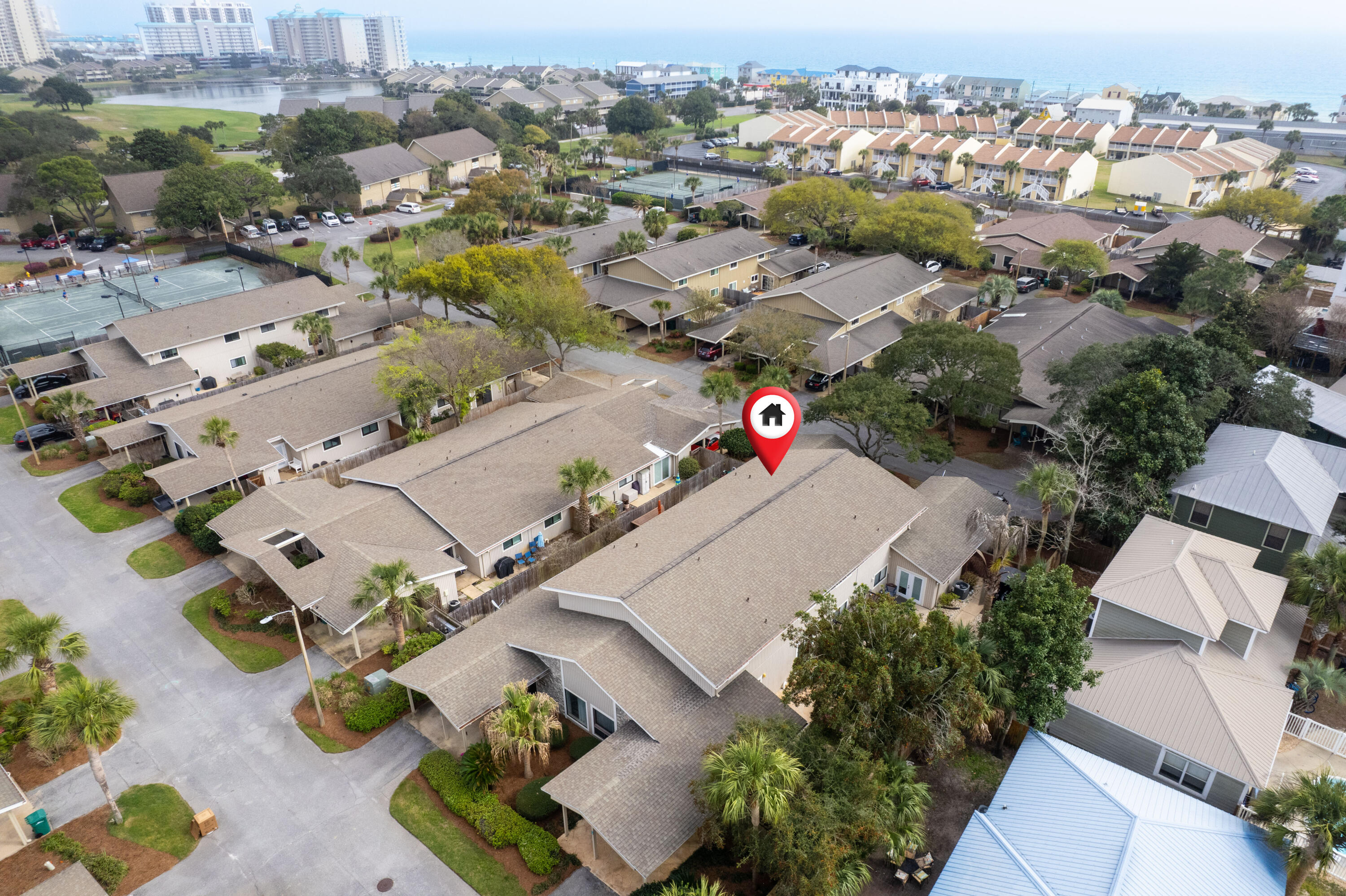 Seascape Resort Tennis Villas condo with 3 bedrooms and 2 baths with OVER 1410 sq feet and the huge fenced in courtyard ONLY found in the tennis villas. This is a RARE 1410 sq ft two story tennis villa. Most tennis villas are 2 bedroom 2 baths and 1004 sq ft. HUGE value appreciation opportunity. Rental income projections are from $45K-$55K per year. The HOA/COA quarterly dues cover nearly everything but the power bill. Tennis courts, pool, sport court and golf course are around the corner. Beach is a short walk or quick golf cart ride. This 20 year family owned property is being sold due to a death in the family.