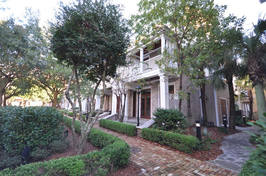 LeJardin is a privately gated community within The Village of Baytowne Wharf comprised of elegant townhomes enhanced by luxury finishes and a private courtyard providing a shady sanctuary from the hot summer days. This 3-story, end unit home features stainless steel appliances, Sub-Zero refrigerator, granite counter tops, jetted soaker tub, high ceilings with stately crown molding, a two-way fireplace in the master bedroom, a balcony on each level, and a nice covered front porch. Beautiful travertine tile flows throughout the main floor, hardwood stairs, and carpeted bedrooms. This home is offered unfurnished and is ready for your personal interior design. Enjoy being conveniently located near fabulous shops, restaurants, and a host of events & nightlife at the Village of Baytowne Wharf.