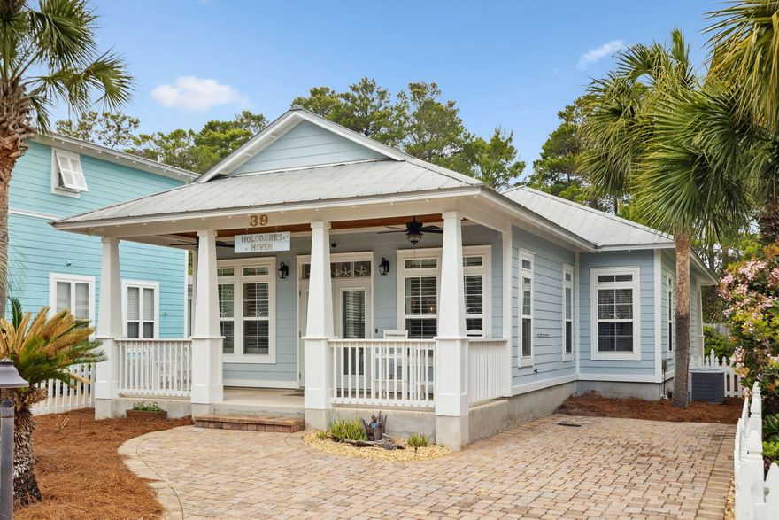 Nestled in a peaceful cul-de-sac, this charming beach cottage offers the perfect blend of coastal charm and modern convenience. Just minutes from the beach, this single-story, 3-bedroom, 2-bathroom home is an excellent choice for a full-time residence, vacation retreat, or investment property.A welcoming front porch invites you inside, where an open-concept living, dining, and kitchen area creates a warm and inviting atmosphere. The kitchen is beautifully updated with stainless steel appliances, freshly painted white cabinetry, new elegant quartz countertops, and new light fixtures that add a modern touch to the space. The spacious primary suite is designed for relaxation, featuring a private en-suite bath and a generous walk-in closet with upgraded custom shelving. Large windows allow natural light to fill the space, while plantation shutters provide privacy and a touch of coastal elegance. The en-suite bath includes a new quartz-topped vanity, a glass-enclosed tub, and stylish tile flooring for a spa-like feel.

Two well-appointed secondary bedrooms provide comfortable accommodations for family and guests. Both rooms feature ample closet space, natural light, and new light fixtures for a fresh, modern look. They share a beautifully updated bathroom with tile flooring, new quartz countertops, and a sleek glass tub enclosure.

Additional highlights include Travertine flooring throughout, custom wooden closet shelving, and surround sound audio connections. Thoughtful upgrades enhance comfort and efficiency, such as a sprinkler system, sink disposal, a filtered water faucet in the kitchen, custom closet systems, plantation shutters in the main living area and primary bedroom, plumbing for a Culligan water purification system, a drip irrigation system, a water pressure regulator, and an energy-efficient Carrier air/heat pump. Invisiguard window film adds an extra layer of comfort and energy savings.