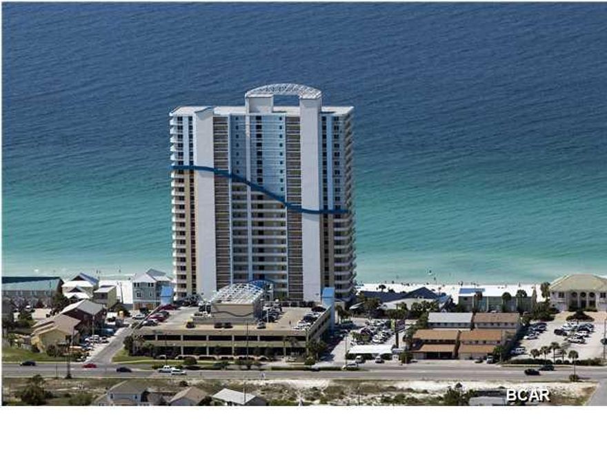 EAST END TOP FLOOR PENTHOUSE CONDO AT SEYCHELLES!! Seychelles is located on the East end of Panama City Beach just minute to St. Andrews State Park and Grand Lagoon. It's tucked off of Thomas Dr. right next door to the well-known Schooner's. This fully furnished 3 bedroom, 2bath condo offers 1,425 sq ft of comfortable living area and endless views from the wall of windows in the living room. Not only do you enjoy amazing Gulf and coastline views,you also capture magnificent Grand Lagoon views from the wrap around balcony and guest bedroom. The spacious kitchen offers a tiled backsplash, stainless steel appliances, excluding the cooktop stove, and a large breakfast bar. The condo also comes with a deeded storage unit. The HOA dues of just $2,542.06 per quarter include all utilities. Yes, I