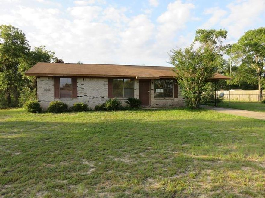 Bungalow home on large lot has tons of potential! Single carport has storage room. Interior features formal living room, eat-in kitchen w/wood cabinets and laundry room, and all bedrooms are cozy including a master suite w/full bathroom. Some TLC and this home will be really charming again. Pretty location north of the downtown area close to Juniper, Holly, and Kings Lakes - for loads of terrific fishing, picnicking and RV camping! EQUAL HOUSING OPPORTUNITY.