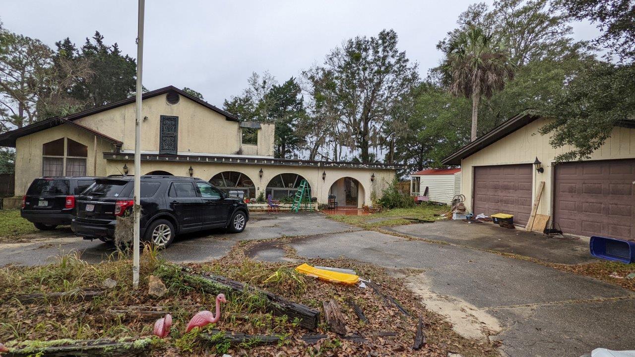 Check out this huge WATERFRONT 4 bedroom 4 bath house on half an acre in a sprawling waterfront estate in Navarre!Amazing views, with beach access provides the ultimate spot to kayak, canoe or paddle board from your own back yard. The dock makes for great fishing and easy access to the bay. The Dock and Seawall are in great shape as well.This home features a 2-car detached garage, a patio, a shed and a 20 x 40 in ground pool!The house will need a bit of cosmetic repairs/updates, and a bit of rehab work has been started as well. The flat roof was just replaced last year while the peak roof is about 10 years old. It has 1 large central AC downstairs(5 years), a smaller AC upstairs(4 years), and a window until (2 months).