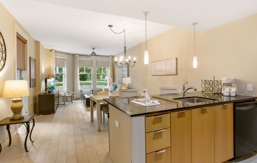 Enjoy easy access to the pool and other amenities from the walk out patio of this very beautifully furnished condo with brand new luxury wood plank tile flooring. An open layout living area offers a flat screen TV and full size sleeper sofa to accommodate extra guests. The  kitchen is fully equipped and complete with granite counters/breakfast bar and custom cabinetry. In the bedroom there is a king size bed and flat screen TV, right next to the large full bath. There is plenty of storage with an owners closet in the condo and a storage cage in the parking garage. Solstice Club on the bay featuring outdoor barbecue area, kitchen and screened porch with fireplace as well as the resort style pool with hot tub and fitness center.