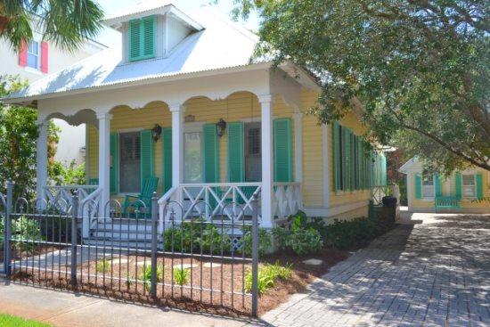 A beautiful home located in the Gated Gulf Front neighborhood of Caribe features architectually controlled Caribbean style. The main house with large front porch consists of 2BR/2BA and the guest cottage has 1Br/1Ba and includes a spacious sleeping/sitting room with morning kitchen & pantry, large closet /full bath and new wood look tile flooring! The main house features include 18' tiled flooring & raised ceilings throughout, interior plantation shutters, hurricane shutters, built-in wine rack, pantry, owner's closet, gas fireplace in the living area and granite countertops in kitchen & baths.(the range also has gas available) The Master Suite includes a separate shower, whirlpool tub and a walk-in closet. Perfect for a primary, secondary or vacation rental home. Caribe is an upscale unique development with a gated entrance, plush landscaping, two swimming pools, tennis court and two dune walkovers leading to the beautiful white sandy beach. Property is centrally located near golf, shopping, restaurants and much more.