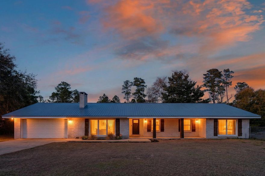 Welcome to your own slice of country comfort on 1.76 acres! This spacious 5-bedroom, 2-bath ranch-style home blends charm, functionality, and room to roam. Inside, you'll love the cozy living room with a beamed ceiling and wood-burning fireplace--perfect for relaxed evenings at home. The beautifully renovated kitchen features granite countertops, stainless steel appliances, and updated flooring, flowing seamlessly into a generous dining area with a convenient counter-height bar for casual meals or entertaining.Four bedrooms and two bathrooms are tucked together on one side of the home, while the fifth bedroom or oversized bonus room sits privately on the opposite end--ideal for a playroom, media space, guest suite, or hobby room. There's even an extra flex room perfect for a home office, gaming space, or secure storage.

Step outside and enjoy the enclosed back porch, rear patio, and fenced areagreat for outdoor fun and gatherings. Need space for toys, tools, or travel gear? The impressive 40x60 pole barn has you covered with room for an RV, 100-amp service, water, lighting, and outlets.

Recent updates add peace of mind, including new windows (2018), a metal roof (2020), and a new well (2024). Garden lovers will appreciate the fully irrigated garden, and yesthere's even a hurricane-proof chicken coop that comes complete with laying hens and a tractor/trailer combo for ease of completing outdoor chores!

This property offers the space, upgrades, and versatility to truly enjoy the lifestyle you've been dreaming of! 