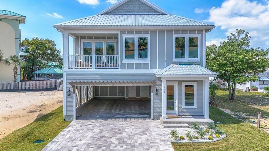Exquisite New Construction Coastal Retreat - Fully FurnishedDiscover this beautifully crafted coastal luxury home, located on the highly desirable West End of Panama City Beach, just steps from the Gulf's most beautiful beaches. Completed, fully furnished, and tastefully decorated, this residence offers both a serene retreat and exceptional income-producing potential.This 5-bedroom, 4.5-bathroom home spans two stories with parking for 6 vehicles and designed for both comfort and sophistication. The chef's kitchen is a true showpiece, featuring upgraded stainless-steel appliances, including a French-door refrigerator, gas cooktop, dishwasher, wall oven/microwave combination, and washer/dryer. Custom 42' white shaker cabinetry, quartz countertops, and a spacious walk-in  pantry complete this gourmet space. The open design flows seamlessly to outdoor living with a 12'x24' private saltwater pool, gas-heated for year-round enjoyment. Additional highlights include:

    "    Gas tankless water heater

    "    Hurricane-impact rated windows

    "    Durable metal roof & Hardie siding

    "    8' interior and exterior doors

    "    10' ceilings on both levels

A spacious game room offers views of the pool, while multiple living areas provide plenty of space for entertaining.
Conveniently located within walking distance to the pristine white-sand beaches, and just minutes to 30A, Pier Park shopping, dining, entertainment, and a short ride to local grocery stores, this home is the perfect blend of luxury and convenience.
\Whether as a private coastal escape or a high-yield vacation rental, this home presents a rare opportunity on the beautiful West end.