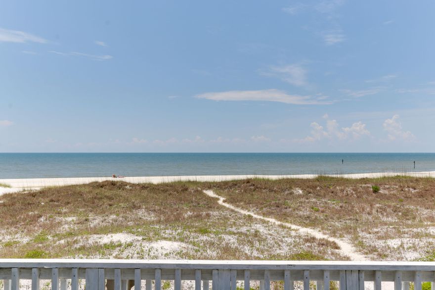 Beachfront townhome with no condo dues! Mexico Beach is a quieter beach on the Eastern end of Bay County - just east of Tyndall Air Force Base. Perfect for a second home, primary residence, or vacation rental - this townhome is full of fun, colorful decor and original artwork. The kitchen cabinets have been painted and distressed with glass knobs - so pretty and beachy! There is dentil crown molding through the living and dining room area. There is spacious room in the kitchen with all major newer appliances to have that perfect seafood dinner - overlooking the Gulf of Mexico! There is plenty of room for dining with a table that seats six plus a bar with stools. You are just a block or so from buying seafood directly from the Gulf!
