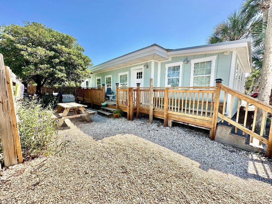 Adorable Cottage Directly on Front Beach Rd-across the street from the beach at Beach Access # 83. No HOA! 3 bedrooms with a bonus room & 2 full baths. Excellent rental with a deep lot, room for expansion, pool or carriage house. The cheerful coastal decor compliments the vintage touches throughout. Updates have been styled to preserve the original character of the Florida Beach Cottage. Endless hot water; Exposed Beams; Updated Flooring, Cabinetry; Granite Countertops; and GE Vintage Replica Appliances are a few of the added features. Future rentals available to the buyer.