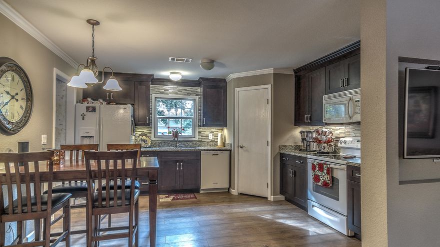 Quiet setting in the heart of growing Freeport. Move in ready home with tons of natural light offers beautiful nature views. Fall in love with the professionally built and installed custom upgrades throughout. Make a feast fit for a king in your new custom kitchen with quality cabinetry, upgraded light fixtures and beautiful granite counters.Master has tons of natural light and a upgraded Master bathroom NOT to be missed! Large soaking tub, perfect for a relaxing evening. Separate stand up shower.Split floor plan allows privacy to Master from secondary bedrooms. Secondary bedrooms have large windows in each and share the secondary bath that sits conveniently between them.Beautiful open living areas with fresh paint and doors. Great outdoor space with room for your favorite activiti