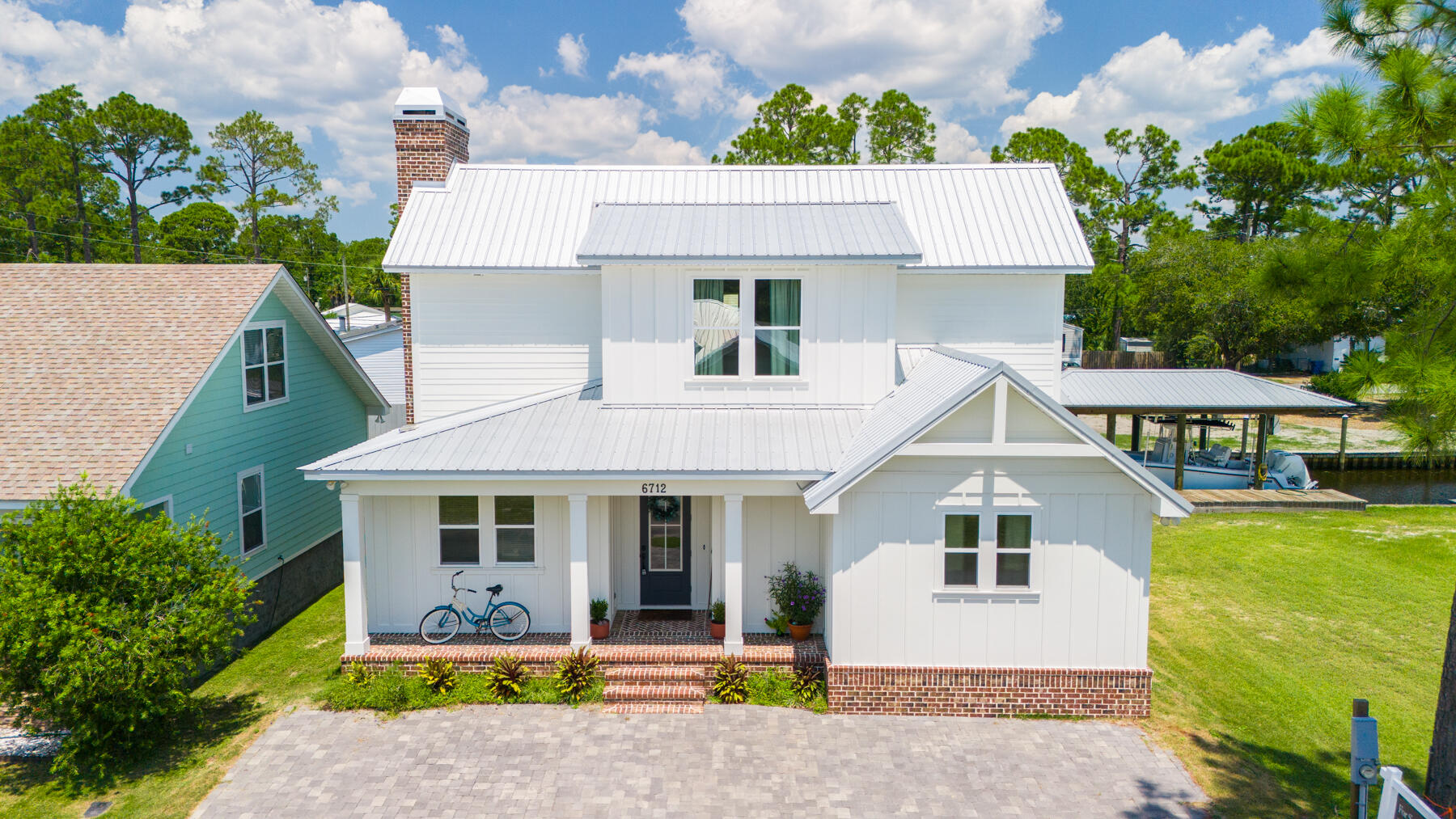 SHORT TERM RENTALS ARE ALLOWED and this WATERFRONT show-stopper has the most luxurious finishes, an incredible floor plan and great access to the Bay and Gulf. Welcome to this beautiful custom-built home on deep waterfront in a gated community...with a POOL! Coastal living at its finest. . This 2021-built home offers 3 bedrooms, a bunk room, 2.5 bathrooms including a waterfront primary suite on the main level! Enjoy having your boat behind your home that offers access to the Gulf and the Bay. This truly makes for the best days spent fishing for redfish, boating to Shell Island and spending time with the ones you love!