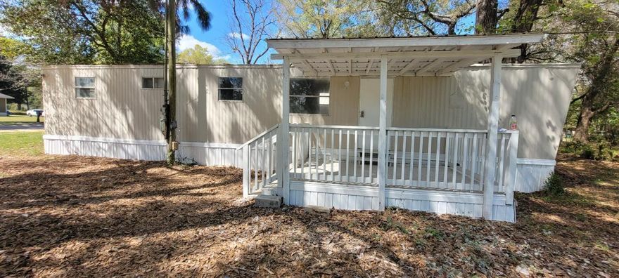 This unit sits separately from the mobile home park. It has its own driveway off the main road. Mobile home was just remodeled to include new flooring, paint, shower, etc. and has a nice covered front porch. Laundry hook ups