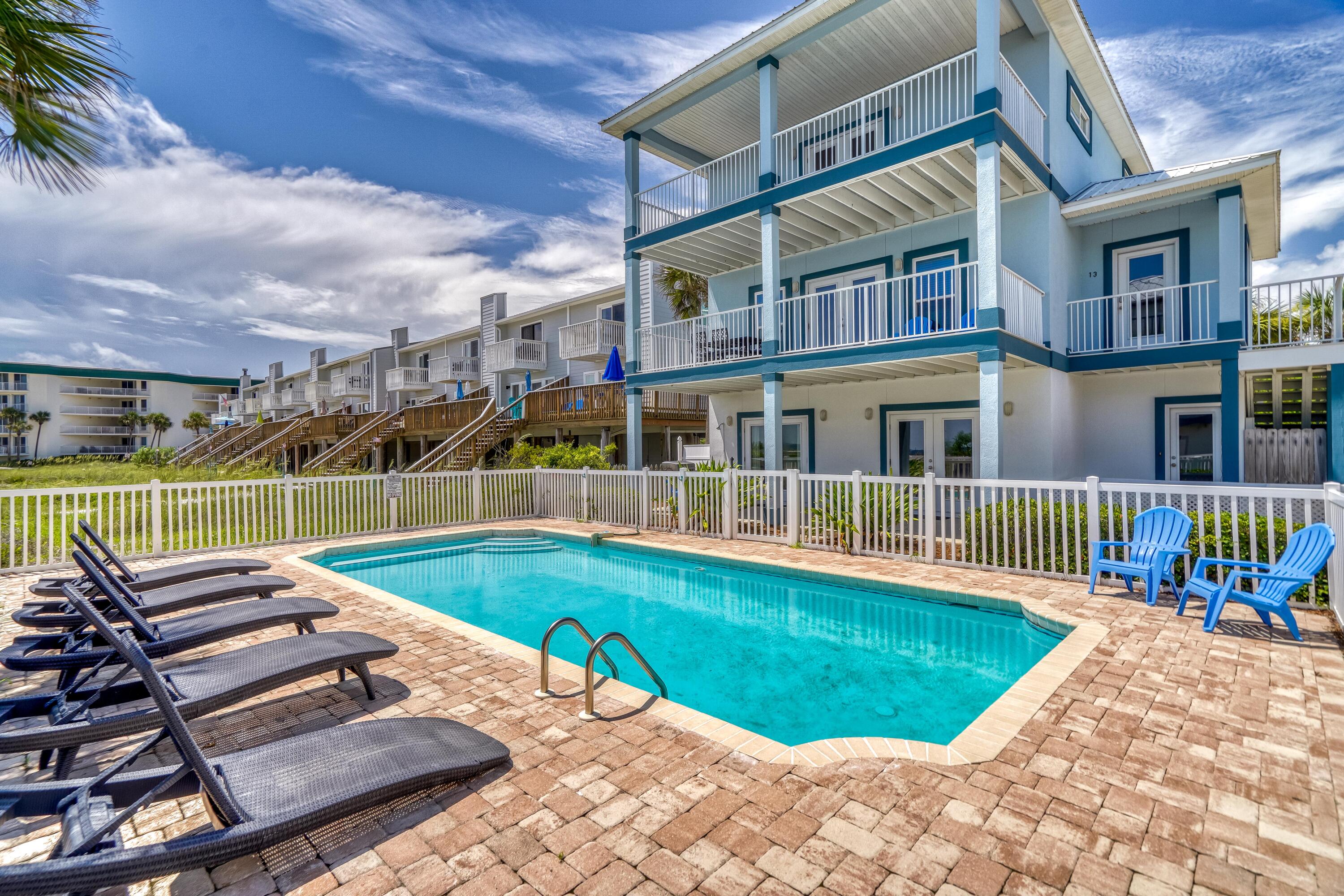 FIND UNOBSTRUCTED GULF OF MEXICO VIEWS from each level of this spacious, three story home with private pool situated in a quiet area of the coveted Seagrove Beach community. Designed to comfortably accommodate a crowd, each story of this home features a living area & large, covered porches with sweeping beach views. The first level offers two guest rooms that share an ensuite bathroom, a kitchenette with eating area & direct access to the oversized heated pool & spacious patio. The primary living area is located on the second level with open spaces, low-maintenance tile floors & neutral hues. The open kitchen has ample white cabinetry, granite countertops including a breakfast bar & stainless-steel appliances. Two guest bedrooms, one with four bunk beds share a jack & Jill bathroom.