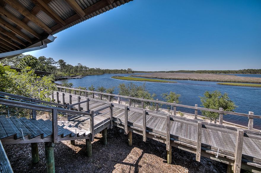 A St Joe development that has no build out time and fantastic amenities for your enjoyment! The community is located 5 minutes from the Panama City Beach airport, 2 minutes to boating/fishing and 10 minutes to the beach. The community has 1500 gated acres bordering West Bay, Crooked Creek and the Intracoastal Waterway. Amenities include a 25,000 square foot Riverhouse complete with a waterfront pool area, boat slips, 600 foot pier, a fitness center with bay views, library, catering kitchen and dining area. The Riverhouse is stocked with kayaks, canoes and bikes for the homeowners and their guests. Other amenities include a boat launch area with boat storage and a private boat ramp for launching boats up to 27 feet. Almost 10 miles of walking or biking trails meander through the community.