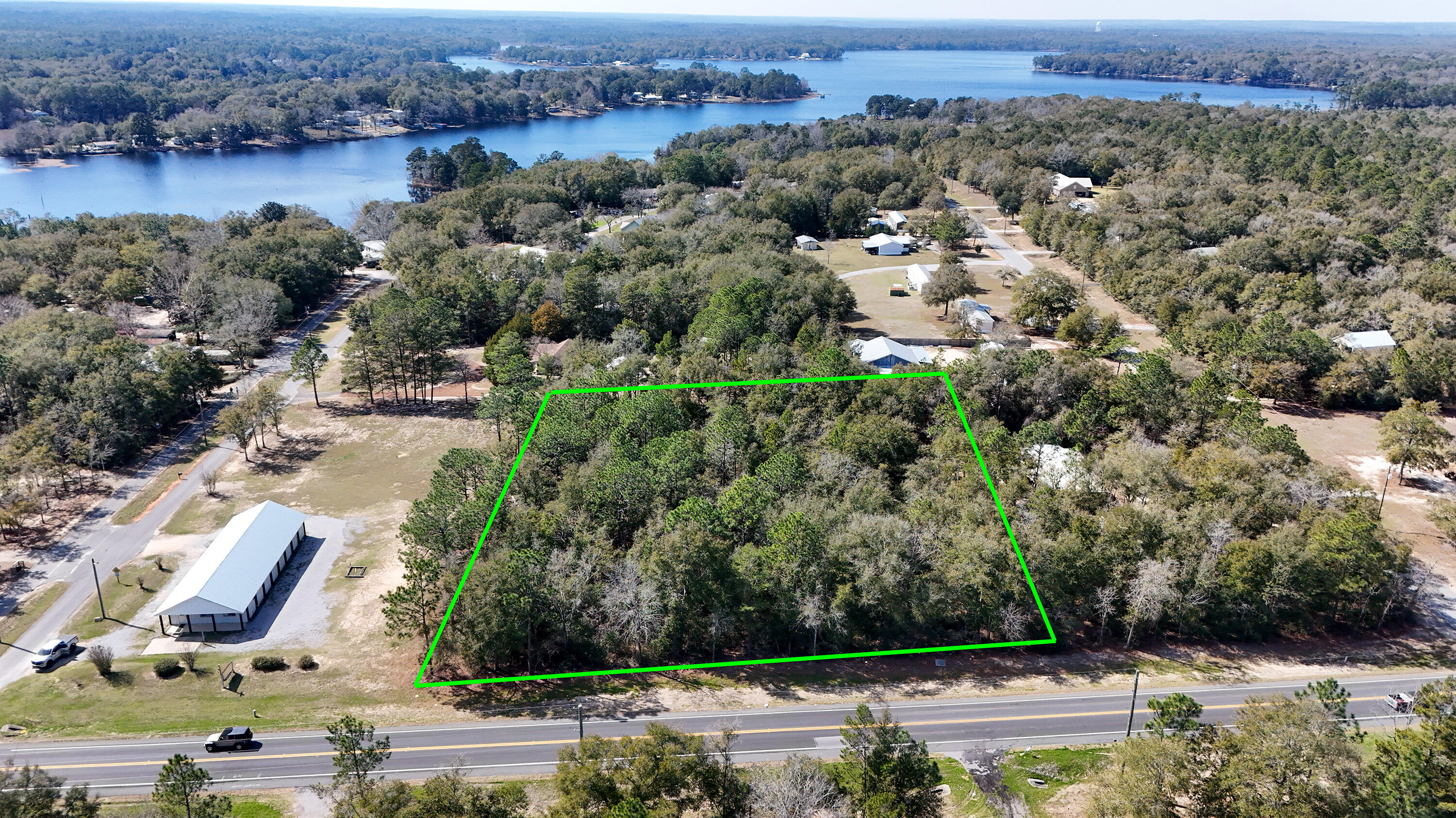This nearly 2 acre parcel is zoned Urban Residential which the Land Development Code states is 2 dwellings per acre. Land is completely flat and has 308' on Hwy 83N, just 3+ miles north of downtown DeFuniak Springs. This could make an excellent homesite for a new build or manufactured home (or several). City water is available and septic would be required. Tap fee has not been paid. Enjoy several nearby public parks with playgrounds, pickleball, fishing and more.