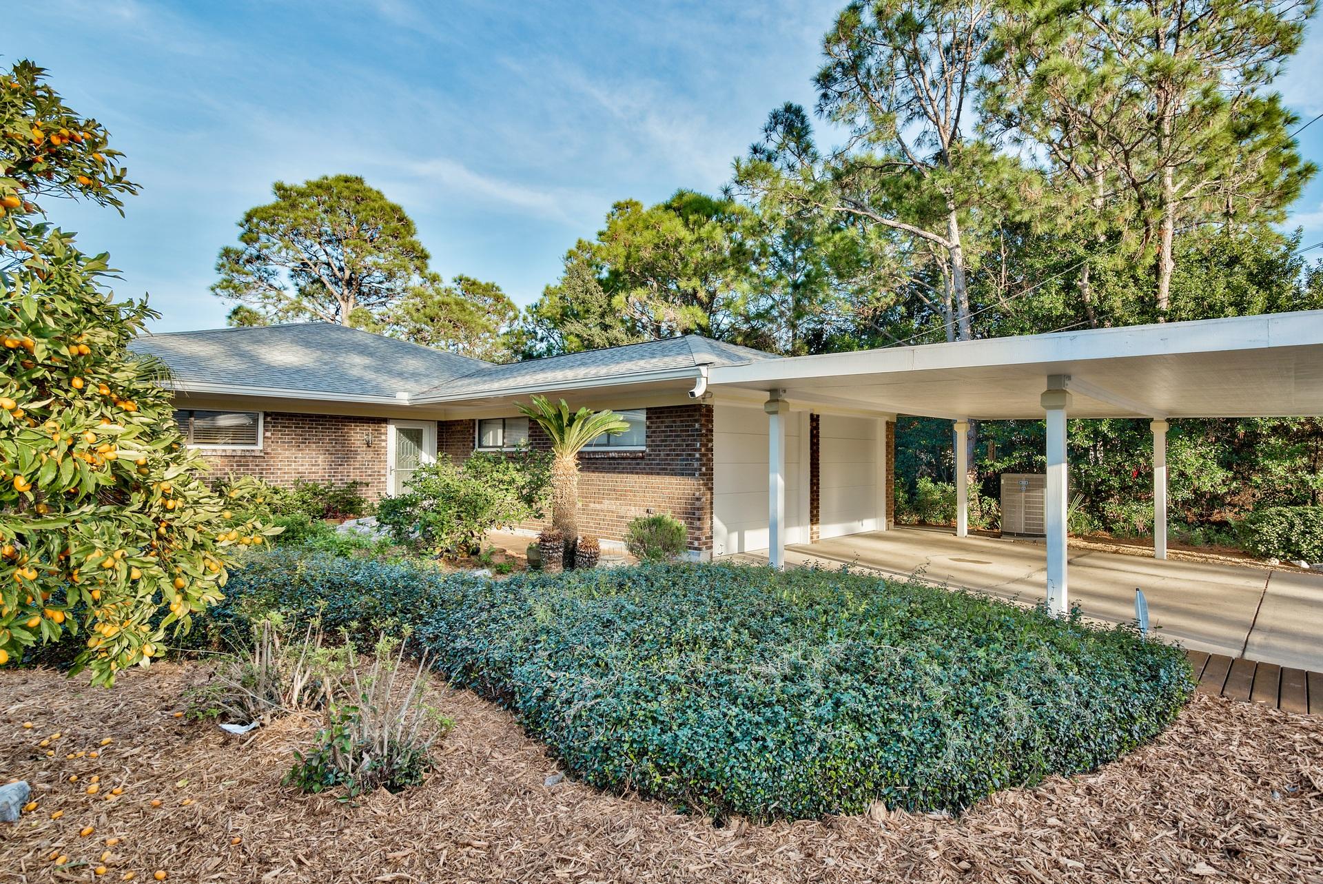Dreaming of a private & serene oasis on the water close to the Gulf at an affordable cost? This is your chance! Phenomenal 3-bedroom lagoon front home located on the east end of Panama City Beach impeccably maintained and no HOA fees! This is a unique home built by an architect with structure and attention to detail in mind. The home has been fully remodeled with custom features throughout including incredible cherry hardwood cabinets, Anderson glass slider doors, porcelain tile floors throughout, upgraded lighting and more. Glass sliders and windows wraparound the entire back of the home bringing in picturesque views of the lagoon. Enjoy an expansive back deck and an oversized dock that was grandfathered in complete with a built-in picnic table, 10,000 pound lift and cleaning station.