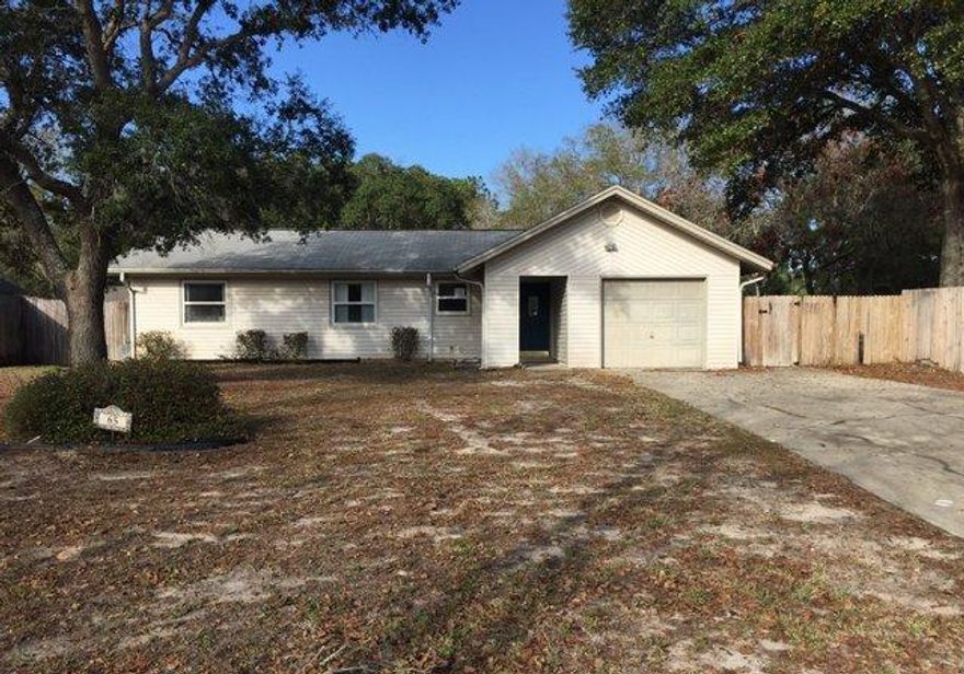 REO ~ Charming Ranch w/ Lots of Potential... This 3 Bd / 2 Ba home is situated on a spacious fenced lot just a short distance to Eglin AFB. Hardwood floors are offered through out the main living areas of the home including all three bedrooms. Don't miss out on this great home.