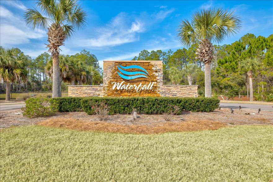 This gorgeous 3 bedroom 2 1/2 bath townhome end unit resides on an oversized premium lot with a single car garage! Walk into a large open floor plan offering nearly 2,100 square feet of fine living space! Create gourmet meals in this remarkable kitchen with granite counter tops, tiled backsplash, stainless steel appliances, breakfast bar, and beautiful cabinetry. The main living area boasts 10' ceilings, LVP flooring and wood lap siding accents the walls. An abundance of natural light flows through the many windows. The Master ensuite includes a substantial walk-in closet, Master bath with double vanity sinks, and granite counter tops complimented by a garden style tub and walk-in shower. The Waterfall community is within 1.5 miles to the beach, Pier Park shopping and dining! Call today!