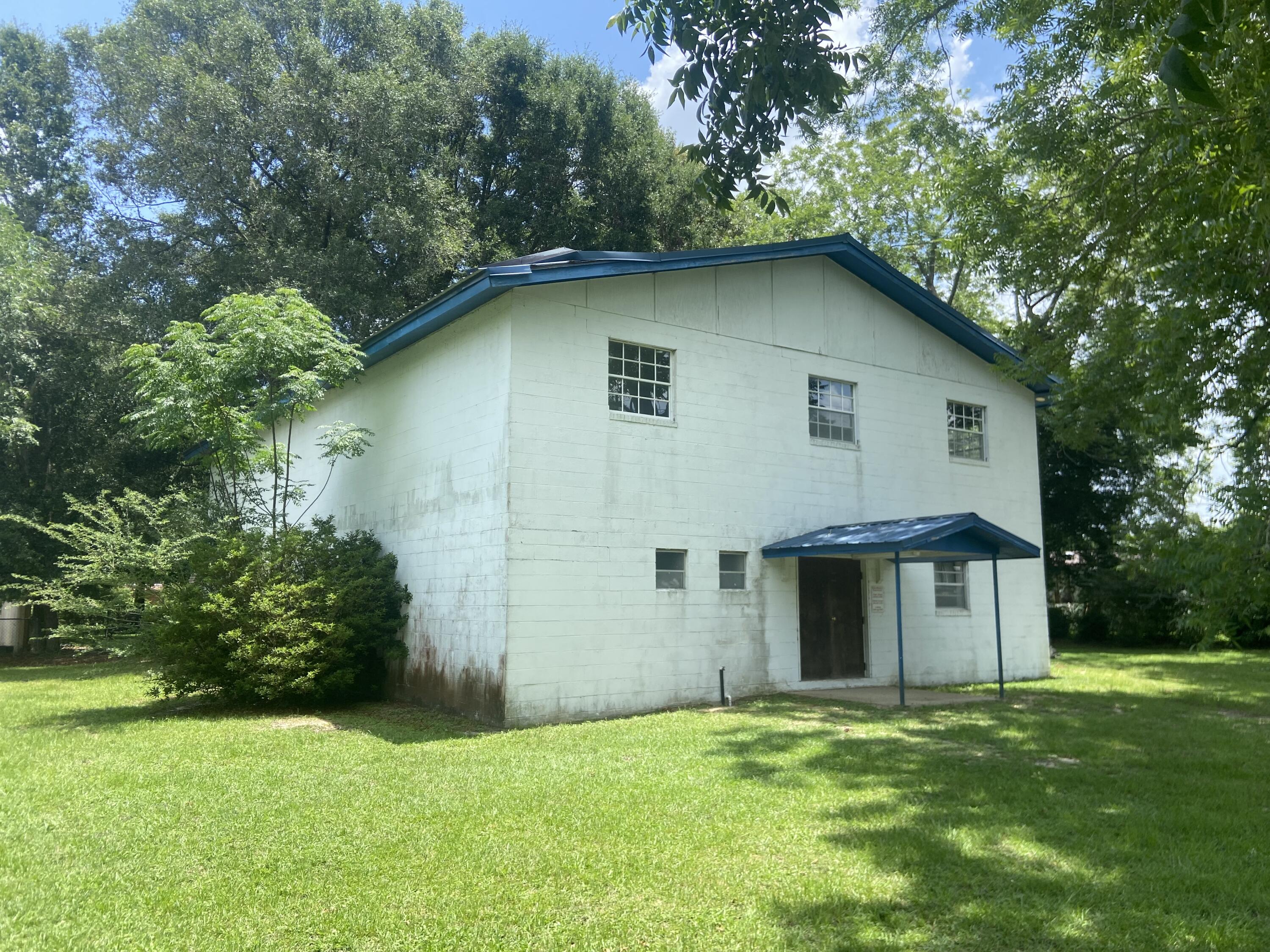 This 4800 sq/ft two story building offered 'As Is' could be converted into possibly anything you want.Storage for inventory of stock, meeting hall, theatre, or convenience store to name a few Ideas. The A/C units are newer, there is a kitchen area, office area, 2 single bathrooms that could possibly be expanded. The building has a metal roof. It does need some TLC.Motivated seller, ANY and ALL offers WILL be considered.