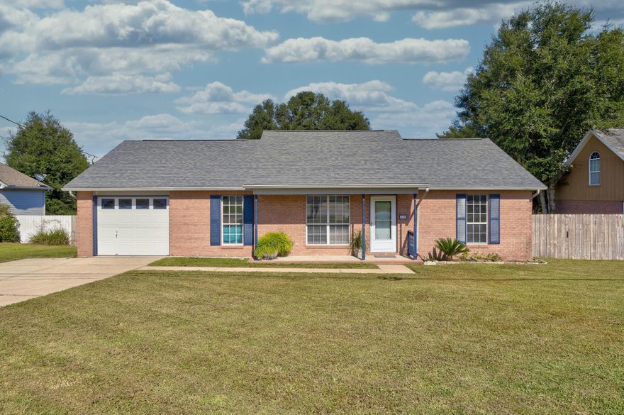 Welcome home! This charming three-bedroom, two-bathroom home is freshly painted and features stunning new premium laminate flooring in the main living areas and bedrooms. The house has a great split floorplan. Enjoy the upcoming cool fall and winter nights by a crackling fire in the living room's wood-burning fireplace. Just off the dining area is a heated and cooled four-seasons room that makes a great office, den, or playroom. The fully fenced backyard has a lovely fig tree, and a storage shed (shed conveys As-Is). New roof installed in 2019.