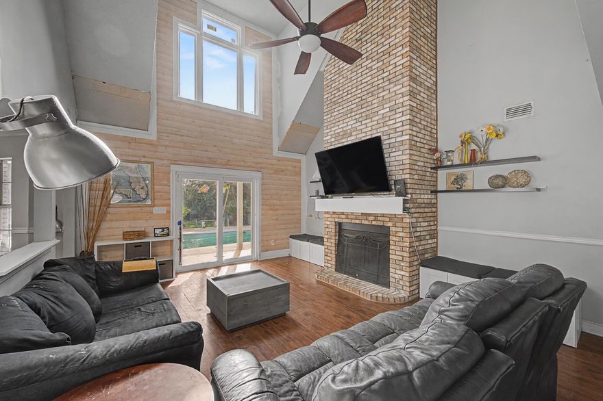 Southern charm, space, and opportunity! This 4-bedroom, 3.5-bath two-story home offers 3,104 sq ft on a .58-acre lot in Mary Esther with no HOA. Featuring a Southern-style front porch with three dormer windows, the home welcomes you into a living room with soaring vaulted ceilings and a floor-to-ceiling brick fireplace. The kitchen offers granite countertops, ample cabinetry, and a center island. The primary suite provides direct access to the pool area and a spacious bath with soaking tub and separate shower. Upstairs you'll find additional bedrooms, loft space, and a large bonus room over the garage. Enjoy the in-ground pool, deck, and expansive backyard. Solar is PAID off! June appraisal $604K; priced at $490K. Property sold AS-IS, WHERE-IS. Seller will make no repairs.