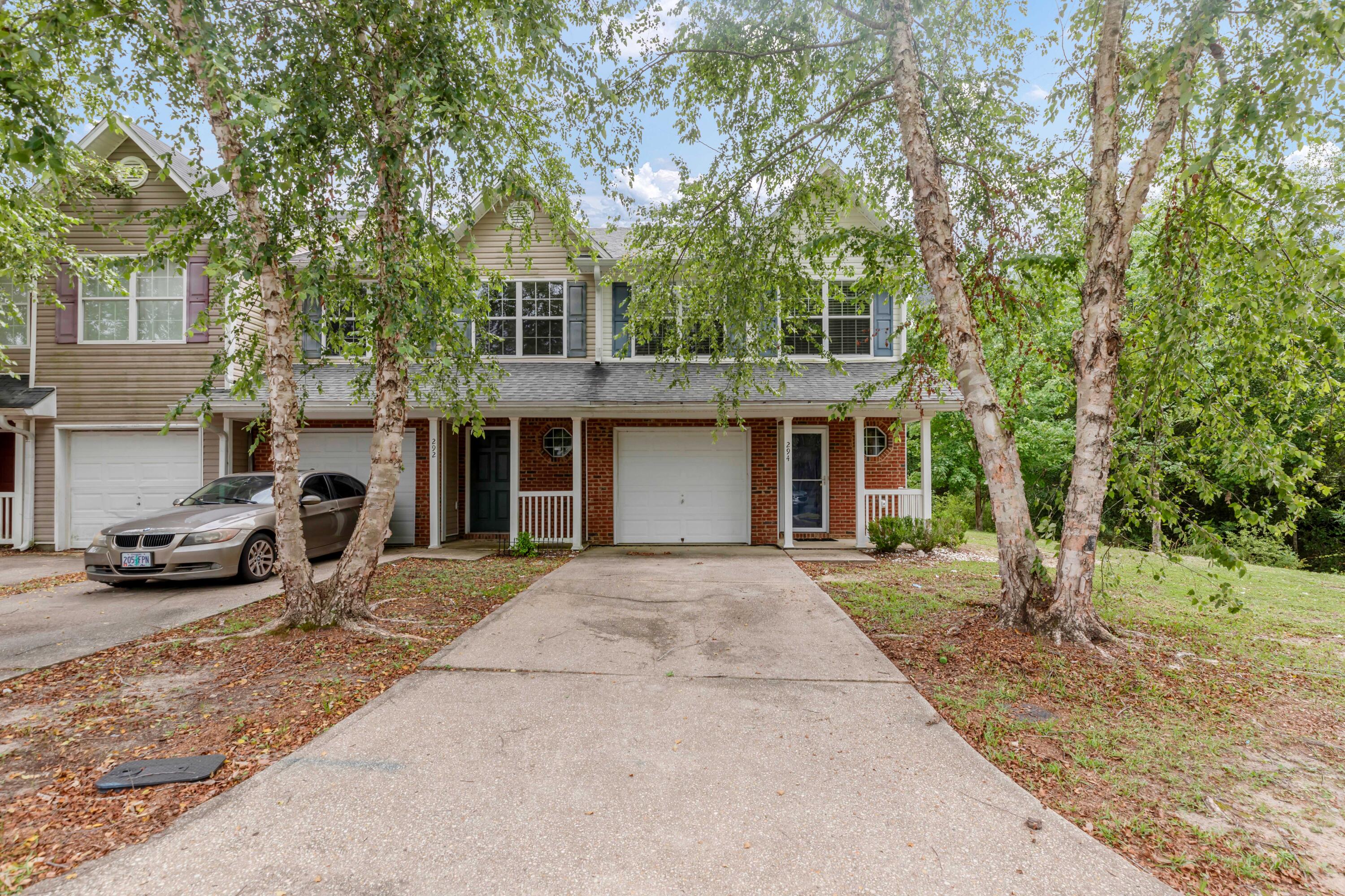 Quiet, end unit in last building on this cul-de-sac/dead end street overlooking a natural area. Newer cabinets and granite in kitchen. Black appliances and built-in microwave. This 2-story town house is near schools, medical facilities and shopping...Just a short drive to our military bases and beaches. You will appreciate this floor plan with 3 bedrooms and 2.5 bathrooms. Master with his/hers vanities and closets has vaulted ceiling. Full size washer and dryer convey. One car attached garage is complete with painted walls and auto garage door opener. Notable: carpet/paint 2023, Roof 2021, HVAC 2019 (coils again 2020), cabinets-granite-patio french doors 2018.