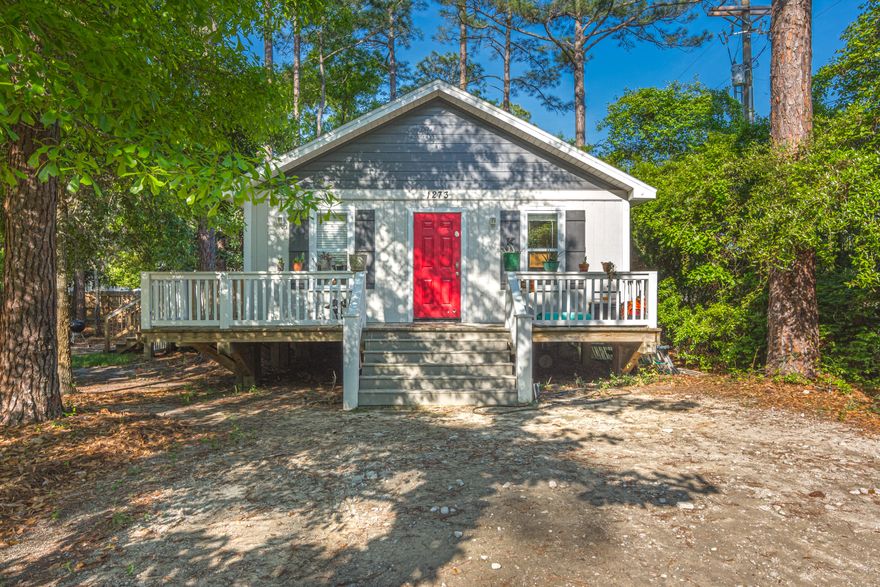 Quiet living in Santa Rosa Beach, don't miss out on this charming cottage styled home situated on a spacious .34 acre lot with no HOA. As you enter the home, you'll love the vaulted ceilings with recessed lighting and the open-concept kitchen and living room, which is great for gathering and entertaining. This home has recently had a kitchen remodel (2018) to include white shaker cabinets, granite counter tops and stainless steel appliances. The home also features hardwood and tile floors throughout. This home is located just 10 minutes from the beautiful beaches of South Walton. You're also just 1 mile from the Chas E Cessna Landing which has a community boat launuch, playground, basketball courts picnic tables, & grilling area. You are just a short drive to restaurants and grocery s