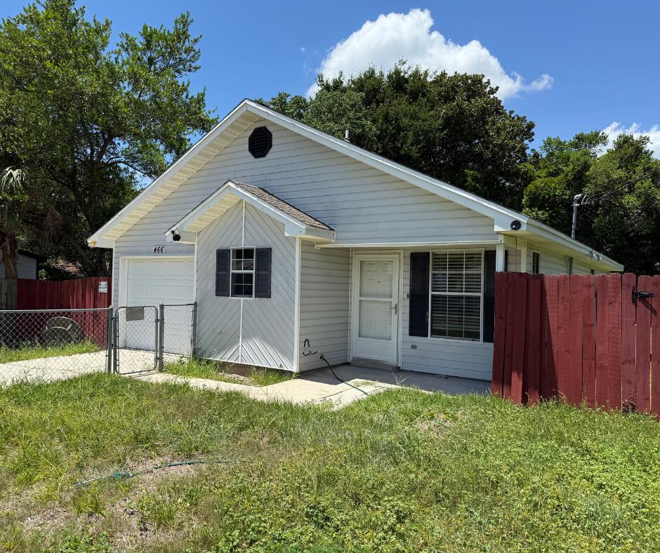 This property is a short sale. Featuring 3 bedrooms and 2 bathrooms, this home offers wood-look tile floors, plush carpet in the bedrooms, and vaulted ceilings that create an open, airy feel. The primary suite includes sliding glass doors leading to the backyard, and a 220V hookup is ready for a future hot tub or outdoor setup. The fenced front yard is great for pets, and the private backyard is perfect for relaxing or entertaining. With a little patience, this short sale could be a great opportunity for the right buyer.