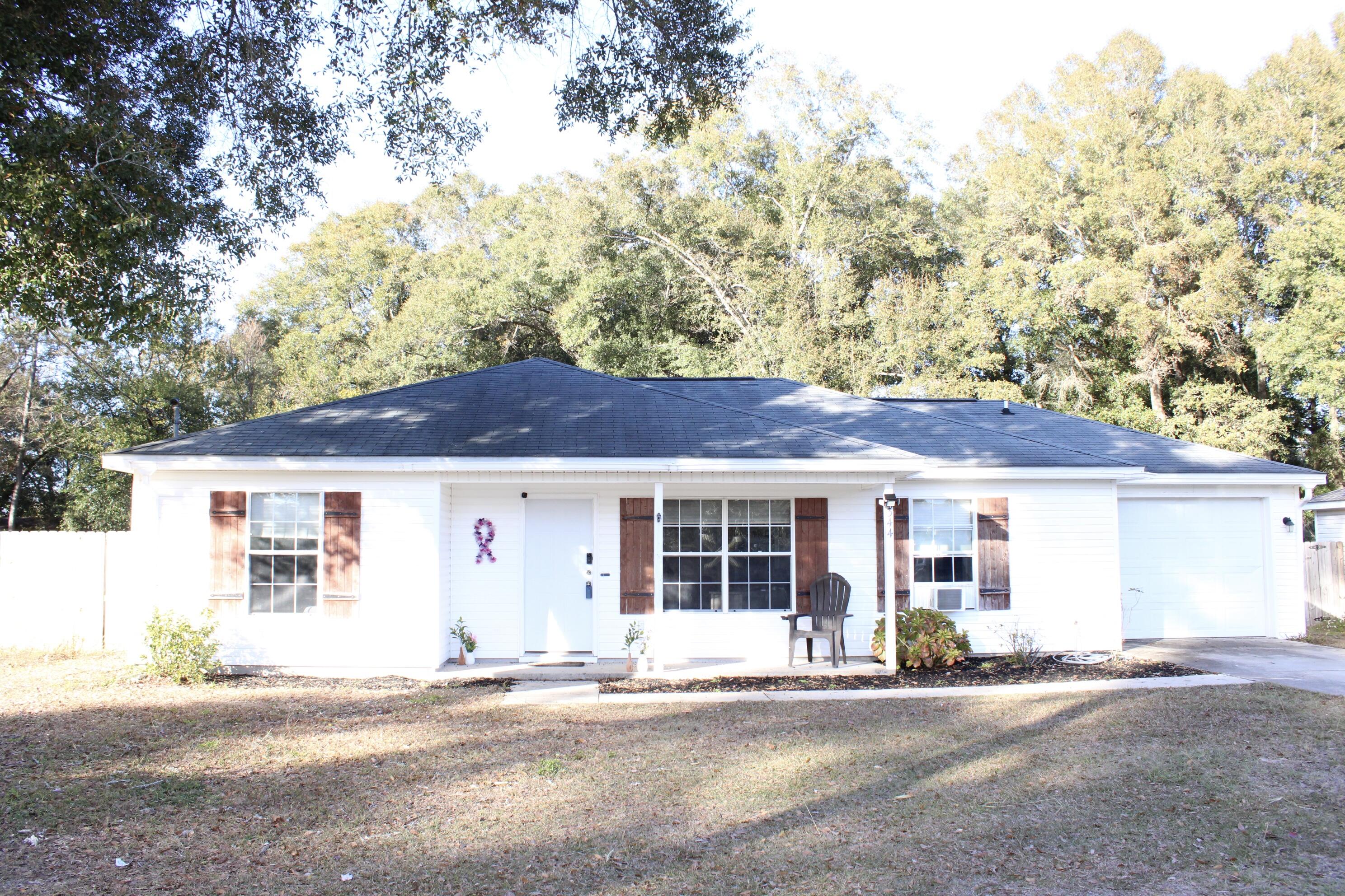 CHECK OUT THIS EXCEPTIONAL HOME! 3BR, 2 Bath, 1209 sf home that is in top-notch condition. HVAC one year old! Laminate wood flooring in living room & master bedroom, ceramic tile in kitchen, dining & baths, some new lighting fixtures, and a huge back yard a with covered back porch. This wont be around for long. Call to set your appointment today