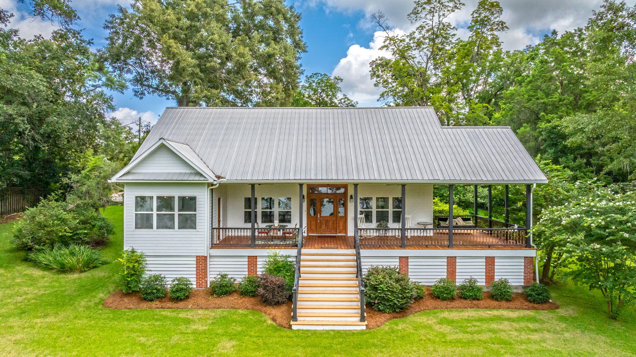 Florala ,AL living at its finest in this charming 4-bed, 2-bath home overlooking beautiful Lake Jackson. This home features a spacious lot with tons outdoor space perfect for entertaining or enjoying the water views. The standout feature is undoubtedly the large front porch, recently renovated in 21, offering a perfect spot to enjoy your morning coffee. Inside, you'll find four roomy bedrooms filled with tons natural light through oversized windows. Home offers everything you are looking for to include a large living, kitchen, and dining room, and huge laundry room. Property includes a deep irrigation well and a brand-new HVAC installed in 24. For added security during severe weather, there's an impressive storm cellar located beneath the house than can also be used for storage. MUST SEE
