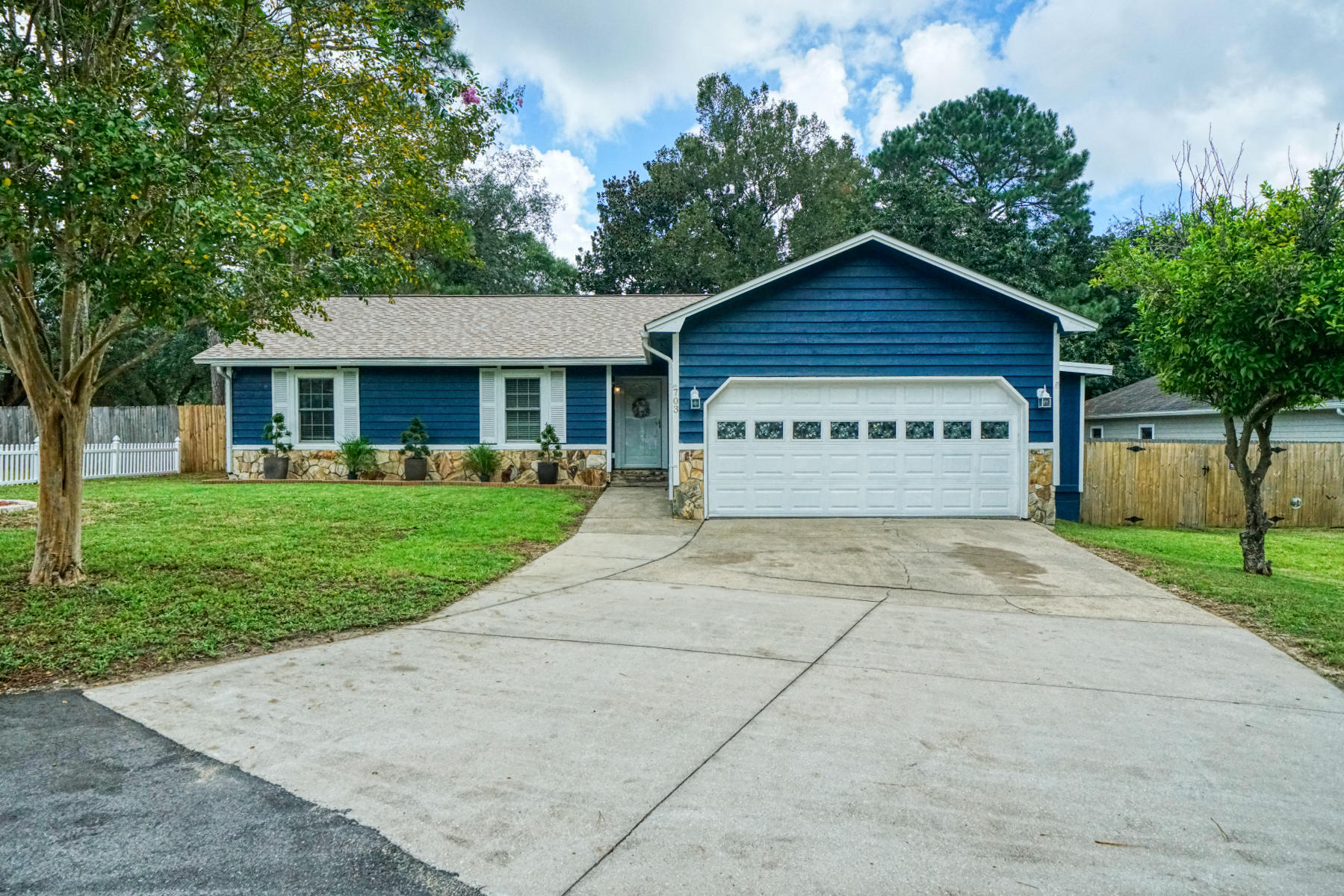 Finally a home with the white picket fence you've always dreamed of! This beautifully laid out and well maintained 3-br home has a bonus room that would make an amazing office, exercise room, or man cave, and is in the heart of Niceville-close to everything! The lot is a huge 0.36 acres and is fully privacy fenced. This Smart Home has lighting that can be voice activated and features the most amazing 400sf Florida room with gorgeous natural light. The kitchen has been beautifully updated, features granite countertops and stainless appliances. Hardwood floors and tile throughout-no carpet! Roof replaced in '17, back section of roof was rerolled/sealed this year. HVAC 1 year old, Stove 1 year old, Dishwasher 2 years old, new front door, new front storm door, yard bldg 3 years old. Be sure