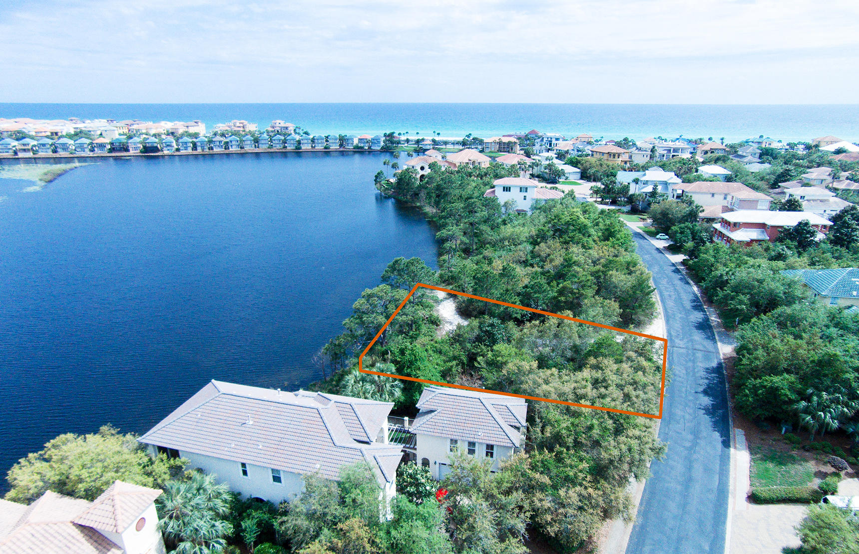 Large lake front lot with great elevation for your home to be built on. Architectural plans (2014) are included with the sale. Located within the gates of Destiny West, which is an exclusive private community with tons of amenities, right across the street from the most beautiful beaches!!