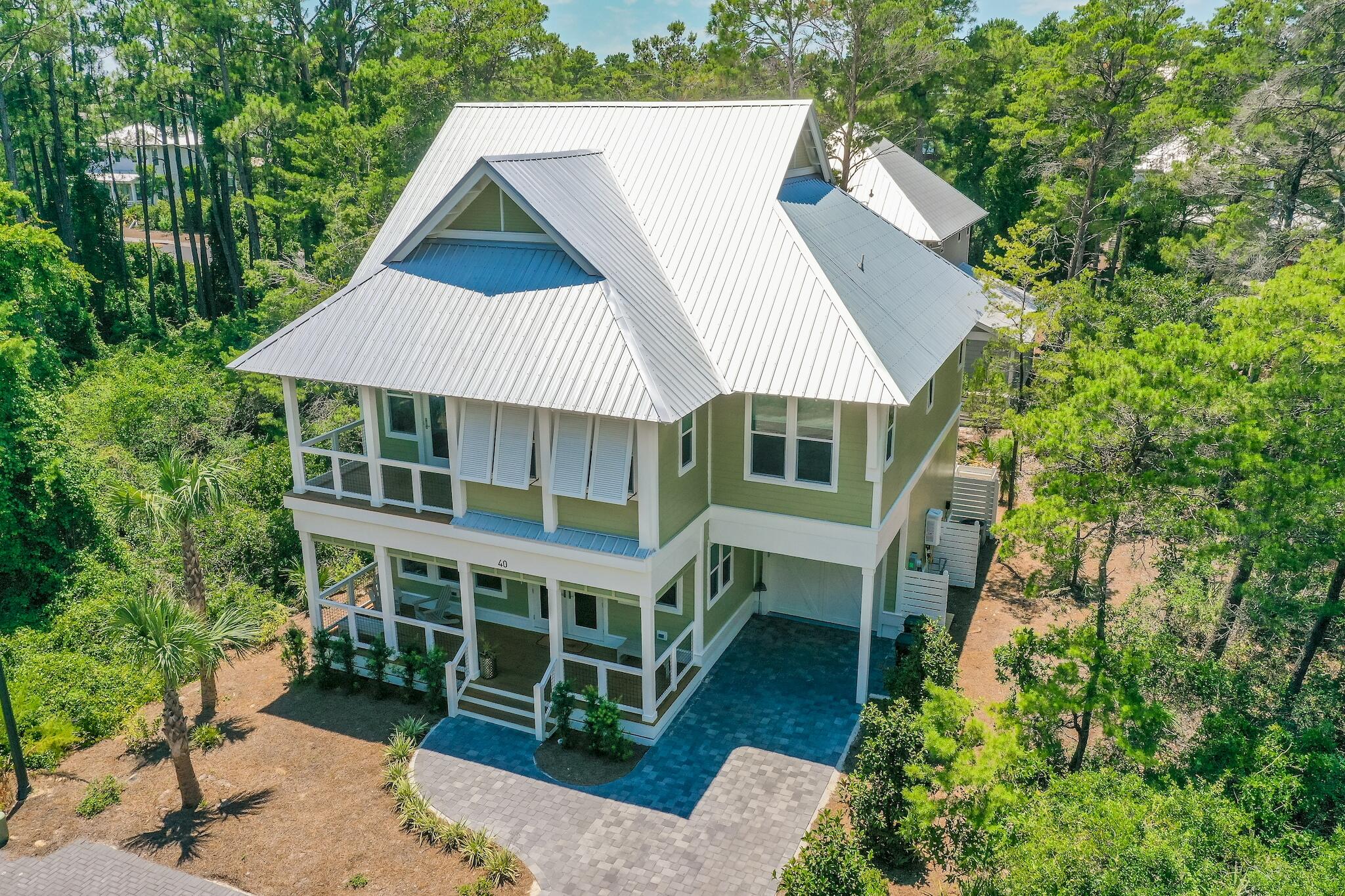 Fully Finished, Pristine Beach Home, Prominently Positioned in Lakeside at Blue Mountain. This 4 Bedroom/4 Full Bath, Two Story Home boasts numerous Custom Features. Fantasy Brown leathered-granite counter tops in the kitchen with high end GE Cafe Matte White Appliances are a perfect complement to the oxidized tile backsplash. Dual Fuel Gas Cooktop, Double Ovens, Micro Convection, an Icemaker, Blanco Sink and Custom Hardware are all the focal point of an Open Living, Kitchen and Dining area. 3 of the 4 Baths have Double Vanities, with Quartz Counter Tops. The downstairs bath has the Gorgeous Leathered Granite. The Oversized Media Room Upstairs is a Beautiful Addition. 5-7 Min. Walk to the Beach. 7 Month Minimum Rental. Pets allowed for a monthly fee.