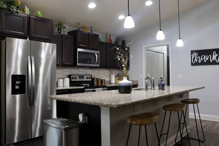 Beautiful ranch style home. Entering to the home you will appreciate the spacious open floor plan with an overlook to the dining/family room, the kitchen comes  w/ granite countertops, stainless steel appliances & ample cabinetry. Luxury vinyl plank adorns the common area flooring. The master bedroom includes coffered ceilings & a walk-in closet. The master bathroom has dual vanities w/granite countertops, garden tub and walk-in shower. Covered back porch, large back yard which is fully fenced. Conveniently located to beaches, shopping, schools, and bases this home is a Must See.