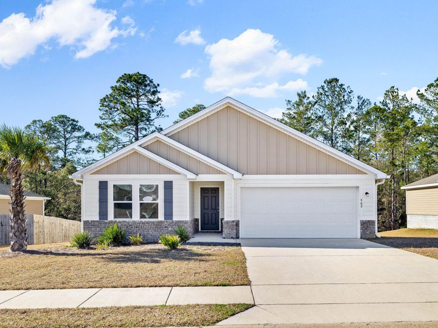 Discover the charm of Cross Creek Estates, where this beautifully crafted four-bedroom, two-bathroom home offers a harmonious blend of privacy and modern elegance. Set against a tranquil woodland backdrop, this residence provides a serene retreat from the every day while being just moments from community amenities. With 1,762 square feet of thoughtfully designed living space, the home is a testament to contemporary style and comfort.  The open-concept layout creates a natural flow between the living areas, anchored by a chef-inspired kitchen featuring sleek granite countertops, stainless steel appliances, and crisp white cabinetry. Just beyond the kitchen, a private deck invites you to bask in the quiet beauty of the wooded surroundings, perfect for morning coffee or evening gatherings. Only four years old, this home feels fresh and inviting, with every detail meticulously maintained.  

The neighborhood enhances the appeal, offering a community pool and playground where neighbors gather and memories are made. Whether you're a first-time homebuyer, a family seeking space to grow, or someone longing for a peaceful retreat, this property offers a rare opportunity to combine privacy, style and value. 