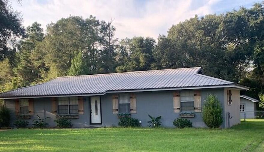 Conveniently located off of Hwy 331 on a private cul de sac. This home has many  quality features recently added.  Vinyl plank flooring, tile flooring, tile countertops and tile backsplash. 4 bdrs, 2 baths, living, dining, kitchen. laundry rm, and a large family room.  The oversized screened  back porch w/outdoor sink/cabinet/bar area overlooks the landscaping and backyard. The large backyard has a privacy fence w/dbl gates. 2 sizable storage buildings and is nicely landscaped. Storm doors on front and back. French doors lead into the private, master suite area. This residence is in great shape and is ready for occupancy.