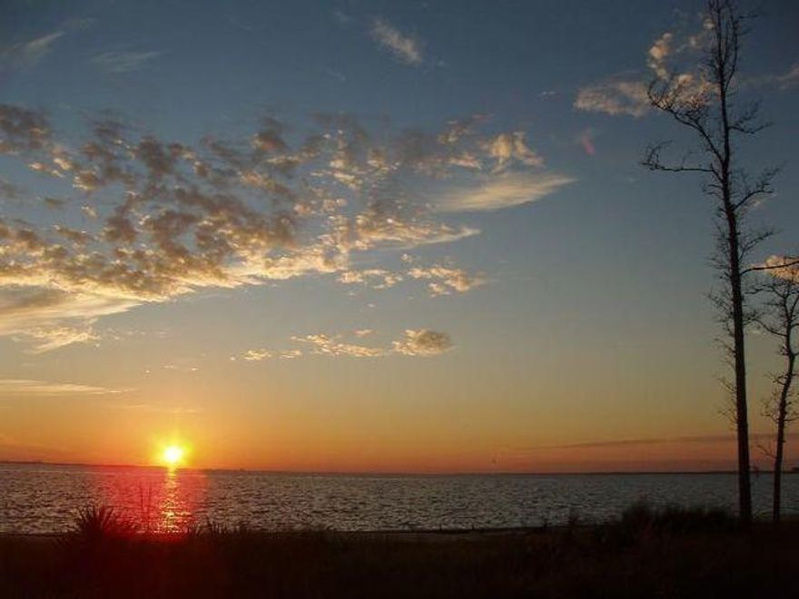 Welcome to Freeport's only Bayfront Community.  Expansive areas of wooded common areas and ponds make for a wonderful ,get-away from it all destination.  76 ft of Bay frontage on 0.36 acres.  Seawall and Rip-Rap in place to protect your dream home on the Choctowhatchee Bay.  Expansiver southerly and westward views across ther bay, and sunsets to die for.  Bay Harbour features nature walks, tennis court, community dock ans well as boat/RV storage.  Come home to paradise on the North Shore!