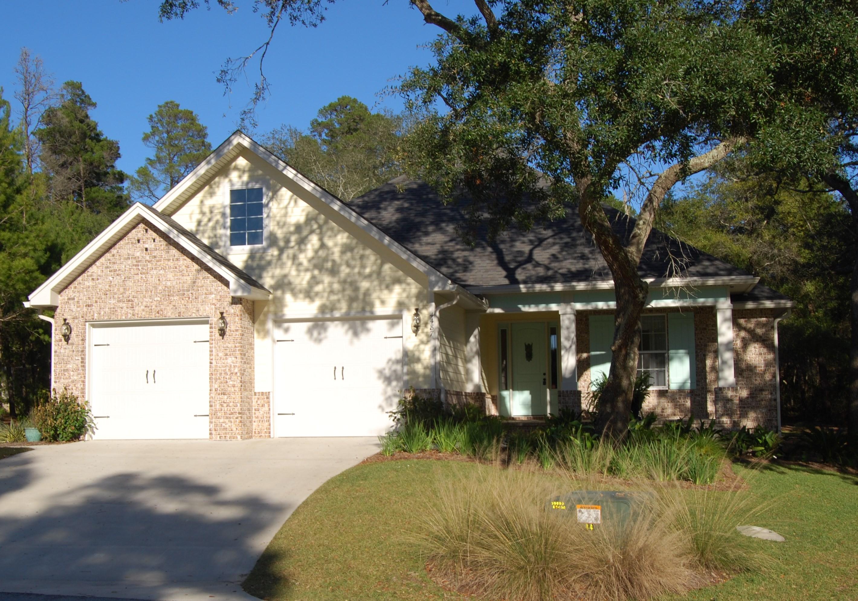 PRICE REDUCED SELLER has relocated and wants contract This custom 4 bedroom 2.5 bath beauty was built by multiple award winning Keylime Home Builders. Nestled peacefully at the end of a cul-de-sac and backs up to wooded Government reservation. So many features to mention including 10-12ft ceilings throughout, wood flooring in main living area, recessed lighting, built in surround sound speakers, security system, energy efficient ceiling fans, tank-less hot water heater AND soft close drawers throughout entire home. Warm, welcoming foyer with dazzling Swarovski crystal chandelier. Family room featuring custom built-in shelving, crown molding and granite wet bar. Kitchen is open to all living areas and is a chef's dream sporting Kenmore Elite stainless appliances, 5 burner gas stove, buil