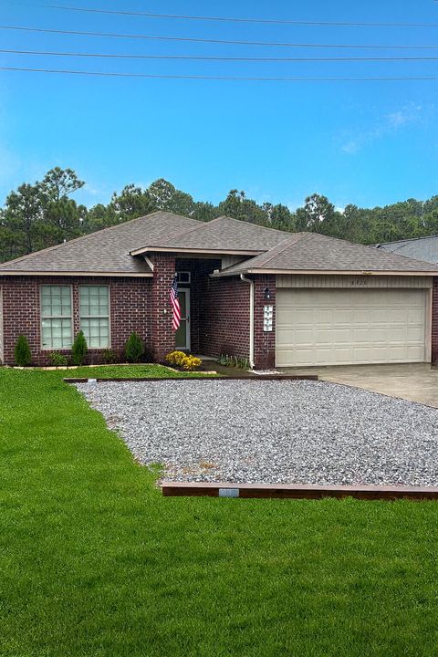 Photo of 8920 Quail Roost Dr Drive, Navarre, FL 32566 (MLS # 990974)