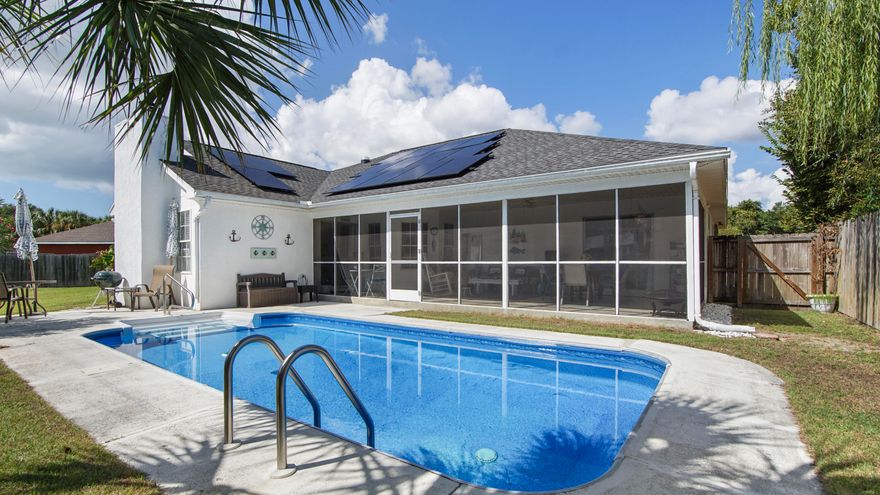 Welcome to 204 Verde Wood Circle, a cozy coastal retreat tucked away on a quiet cul-de-sac just minutes from the world-famous beaches of Panama City Beach. This beautifully refreshed 3-bedroom, 2-bath home perfectly blends comfort, efficiency, and Florida charm. Step inside to find a light, beachy interior with fresh paint and open living spaces that feel instantly inviting. The kitchen and family areas flow effortlessly to a 30-foot screened-in porch overlooking the sparkling in-ground pool, the perfect spot for weekend barbecues or quiet evenings under the stars. The fully fenced backyard offers privacy and space for kids or pets to play, while the two-car garage adds convenience and storage. With a 2024 solar system (loan must be assumed) keeping the average power bill around $30 a month, this home is as smart as it is stylish. Recent upgrades include a 2019 roof, 2018 HVAC, freshly cleaned and sealed ductwork, and a new two-speed pool pump with an easy to clean cartridge filter. Located just minutes from Pier Park, St. Andrews State Park, and the Navy base, this home offers the best of PCB living, and the property can be rented short-term providing even more potential for the property. Your slice of paradise awaits at Verde Wood Circle!